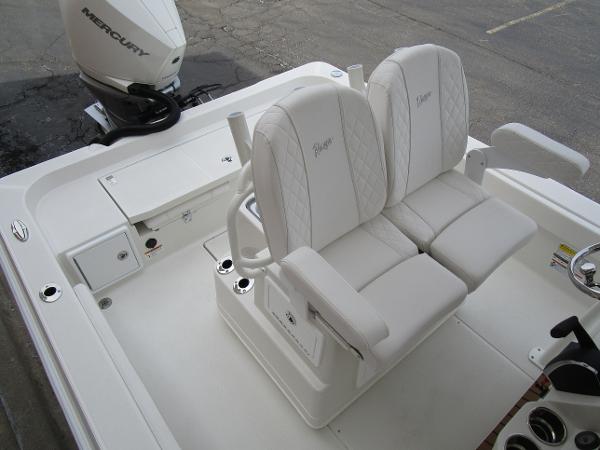 2024 Ranger 2360 Bay boat with dual white captain's chairs and Mercury outboard engine.