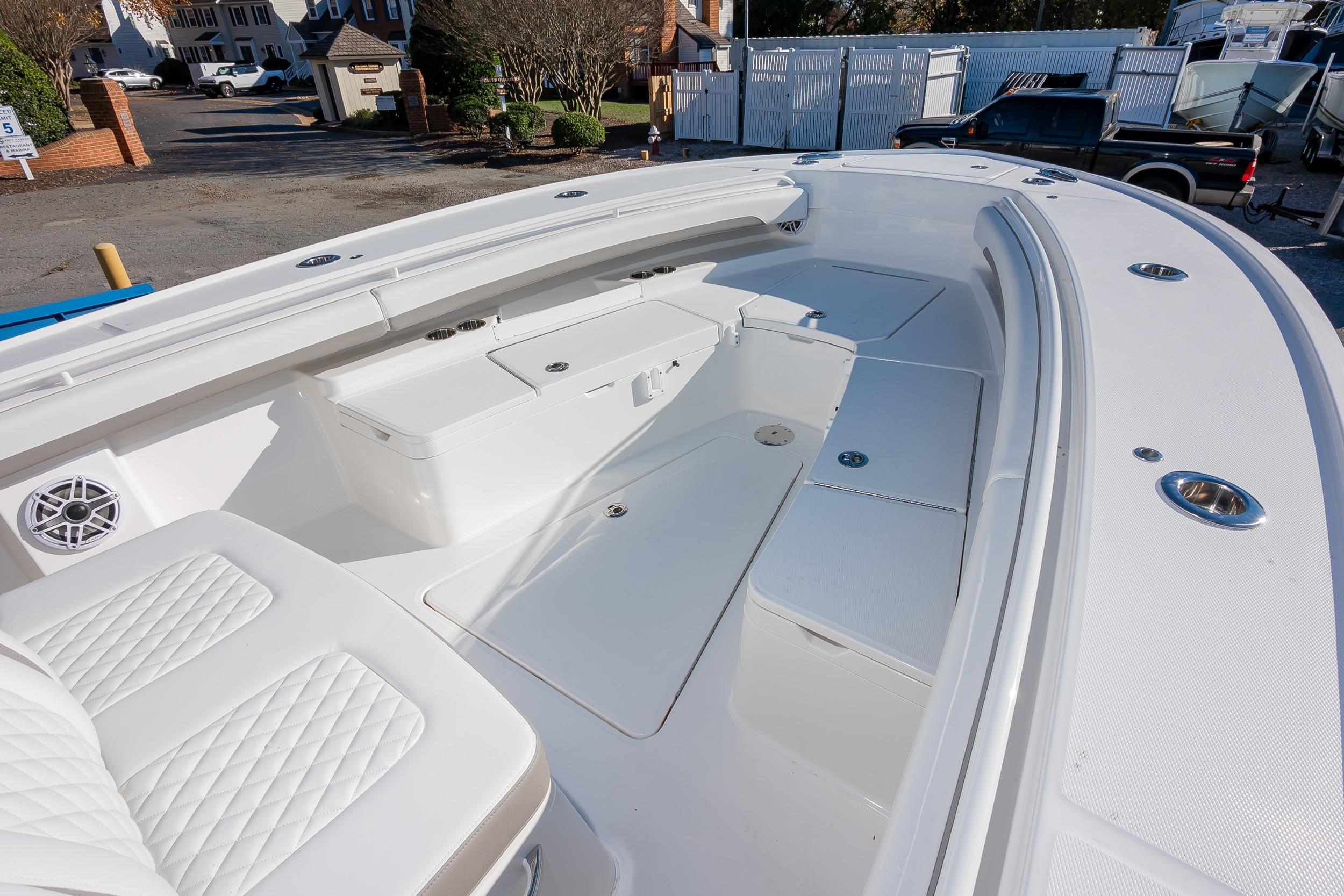 2026 Regulator 28 boat interior with white seating and storage compartments.