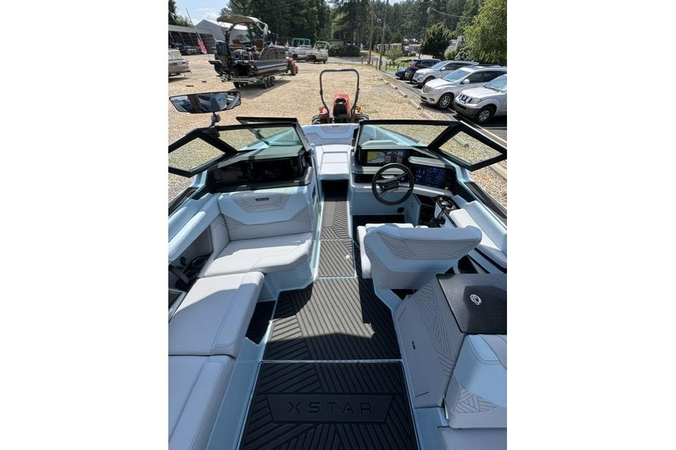 2026 MasterCraft XStar 25 boat interior with modern seating and dashboard.