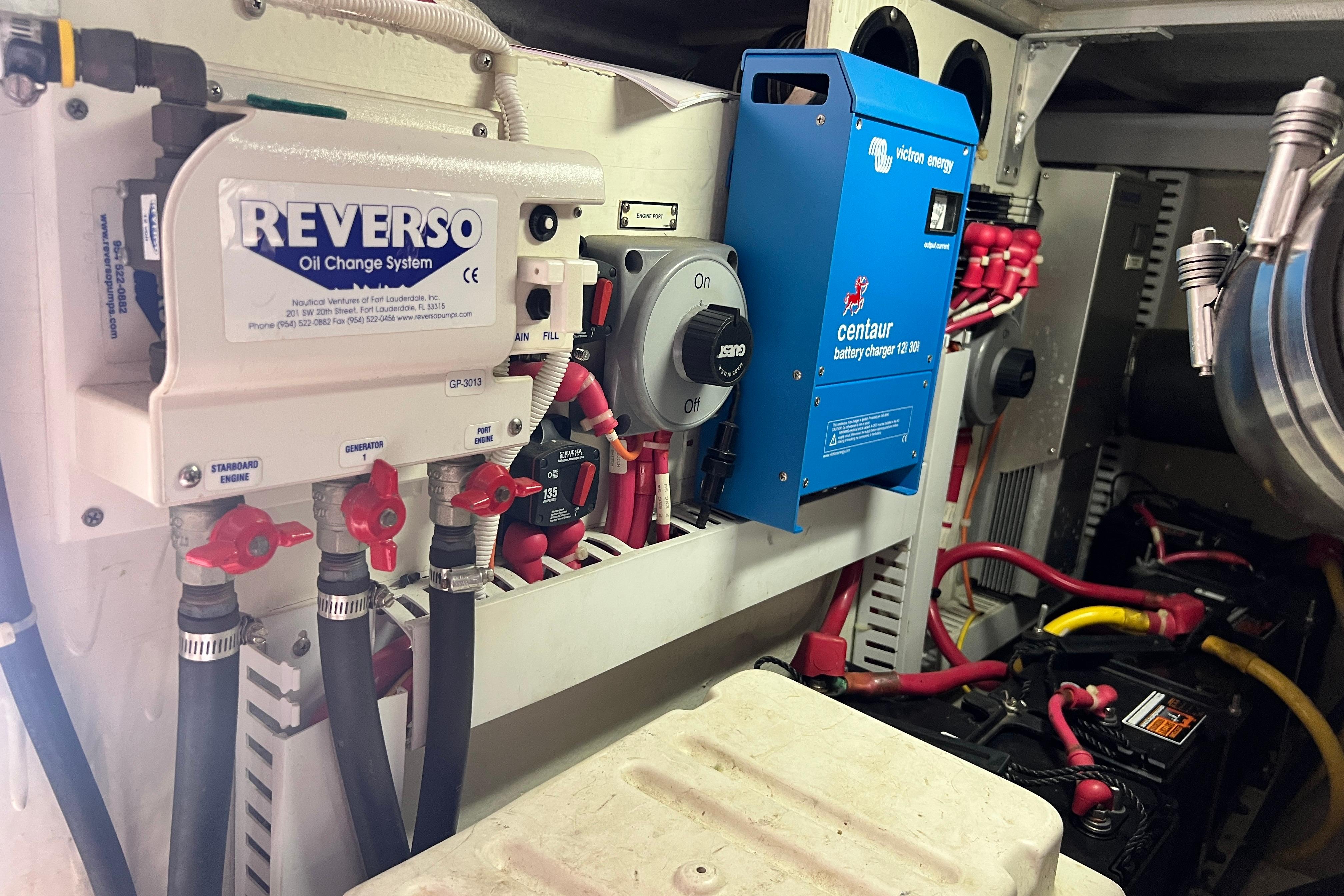 Engine room of 2003 Carver 450 Voyager Pilothouse with Reverso oil change system.