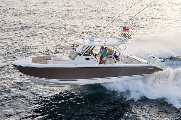 Manufacturer Provided Image: 2018 Pursuit S 368 Sport boat cruising on the ocean with passengers.