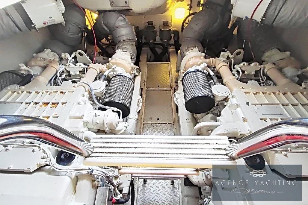 Engine room of a 2004 Princess V58 yacht, showcasing dual engines and mechanical components.