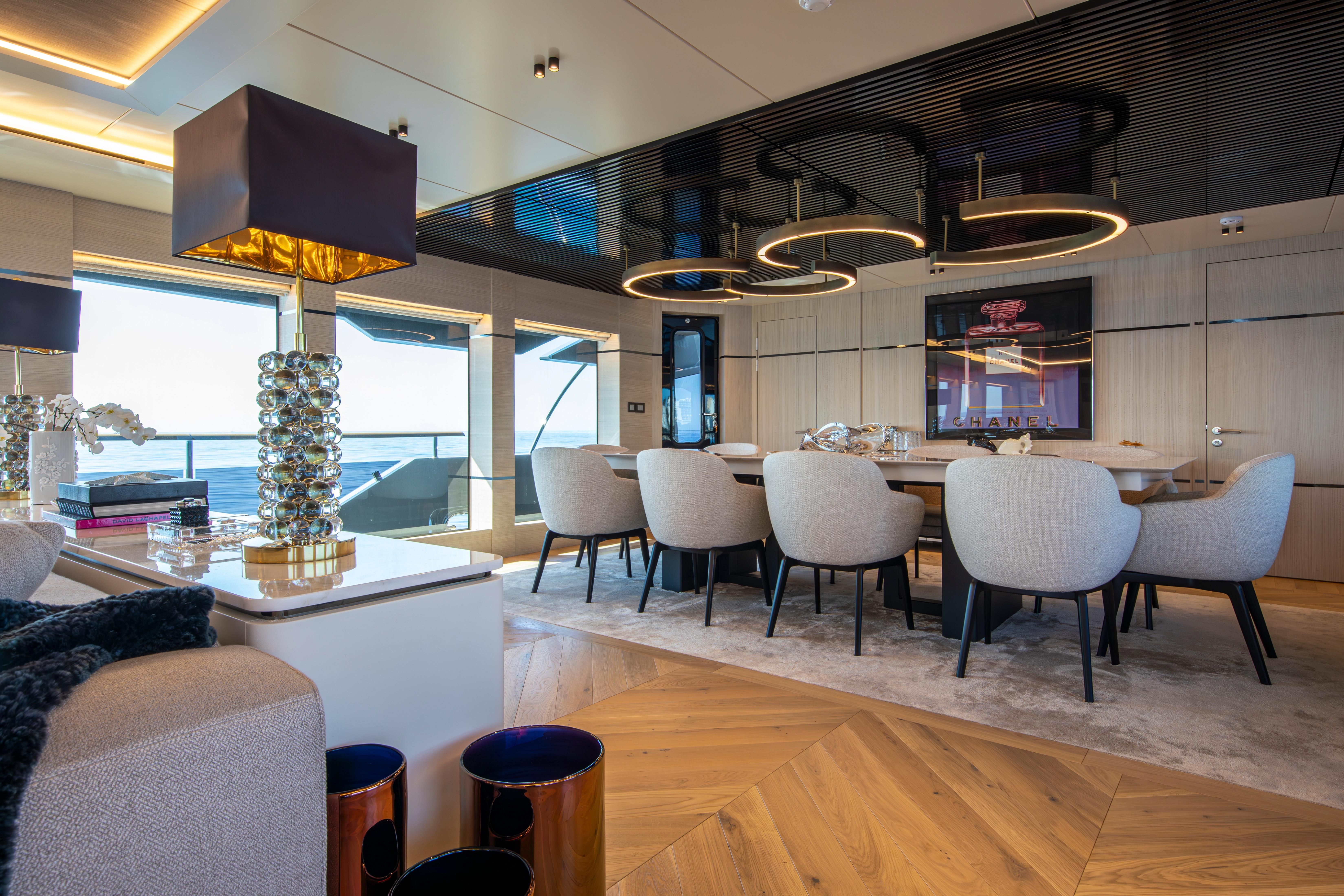 Luxurious interior of 2023 Numarine 37XP yacht with elegant dining area and modern decor.