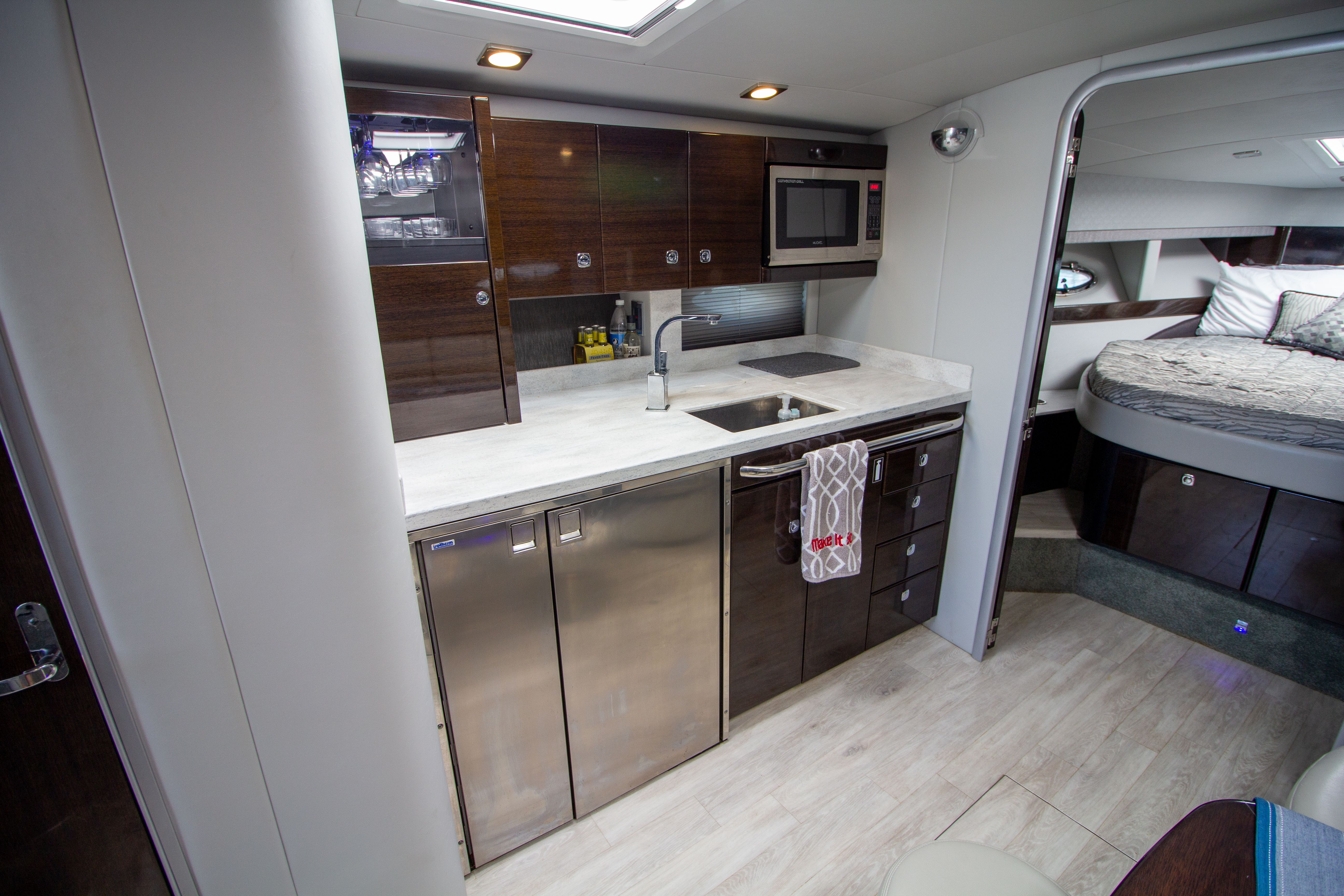 Interior of 2016 Formula 40 Performance Cruiser with kitchen and sleeping area.