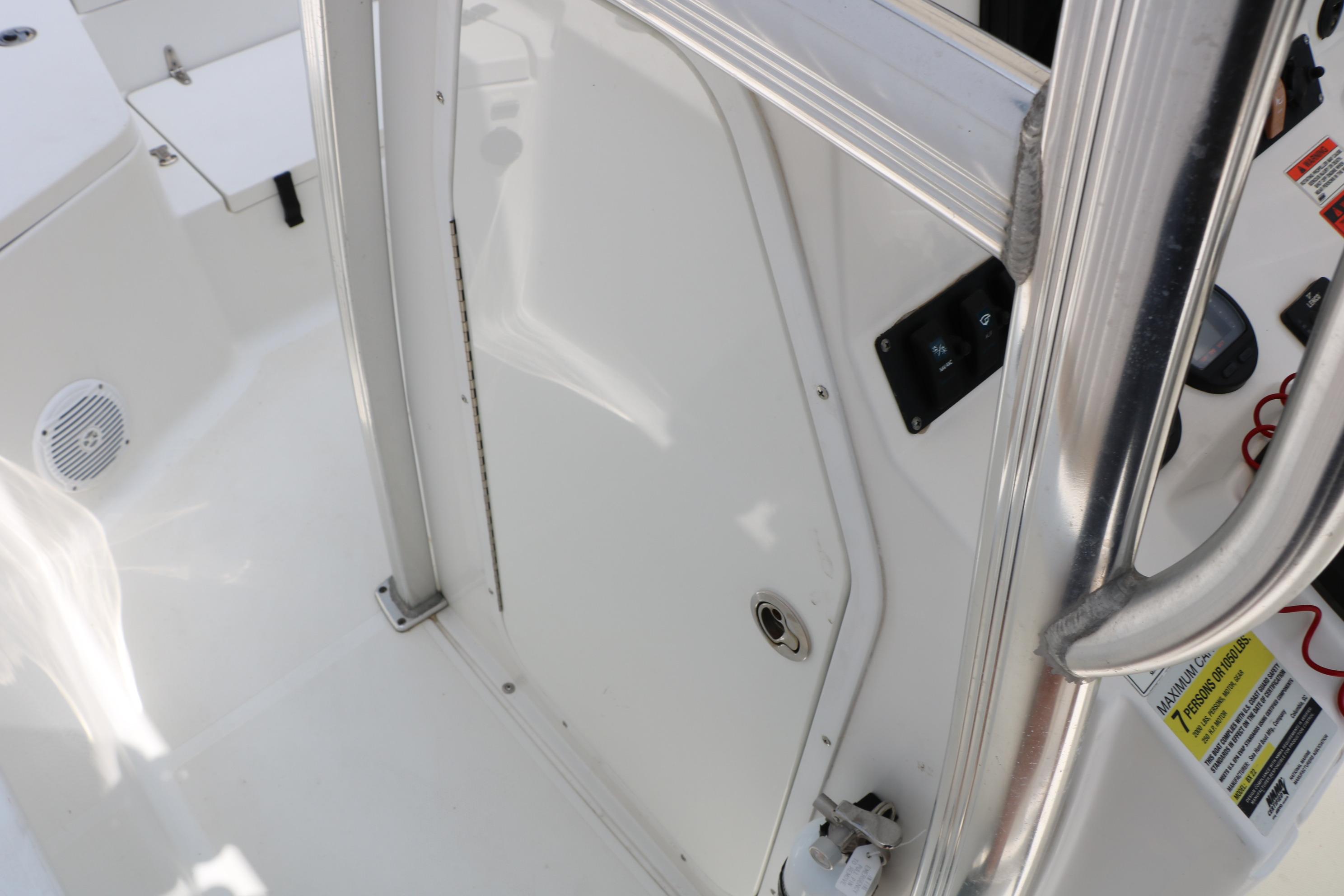 2015 Sea Hunt BX 22 BR boat interior with control panel and seating area.
