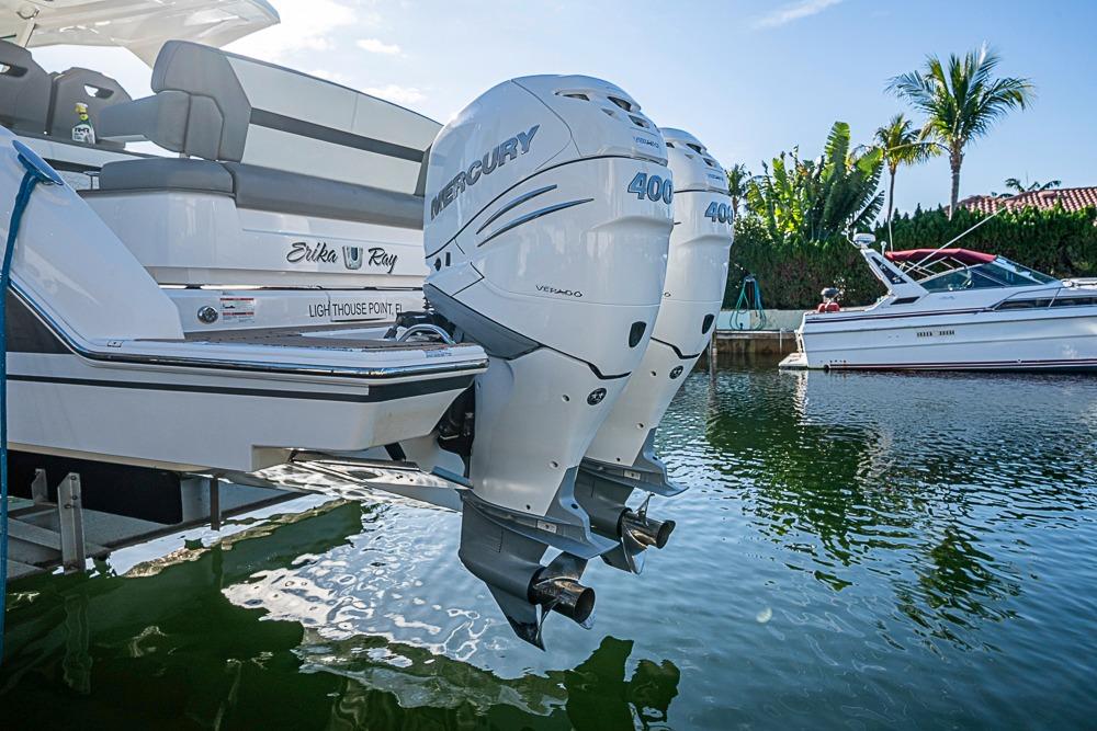 2023 Tiara Yachts 34 LS with dual Mercury 400 engines docked in sunny marina.