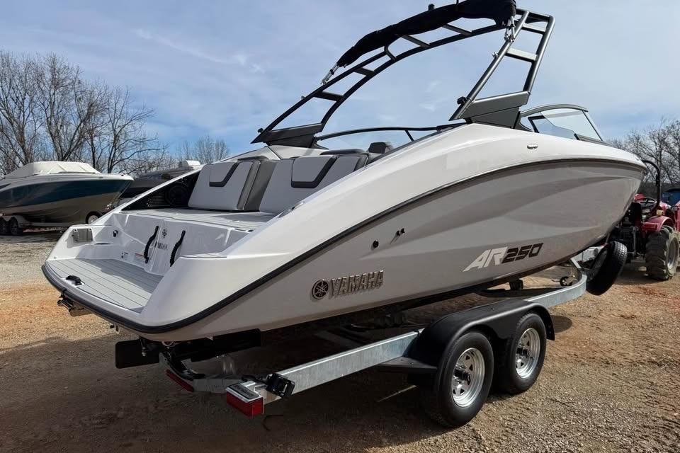 2026 Yamaha Boats AR250 on trailer, sleek design, parked outdoors.