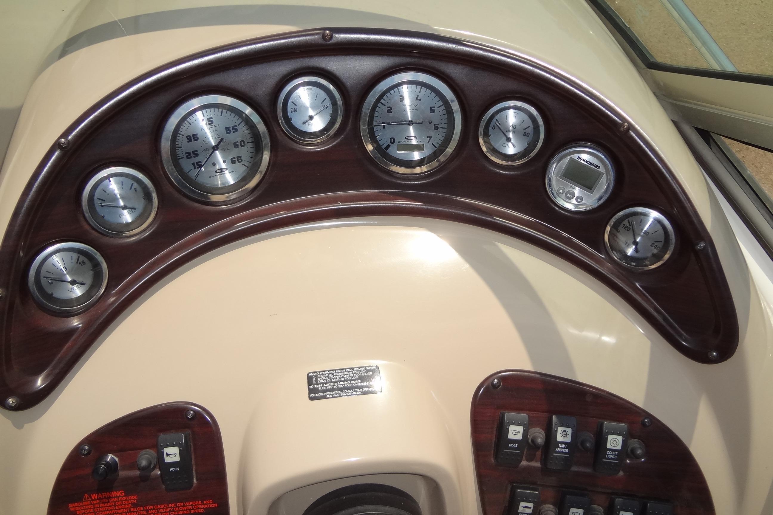 Dashboard of a 2000 Chaparral Signature 260 boat with gauges and controls.