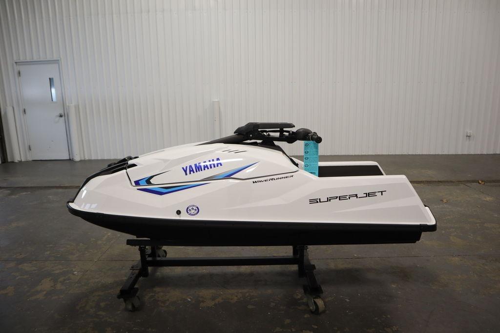 2025 Yamaha WaveRunner SuperJet in a showroom, showcasing sleek design and advanced features.