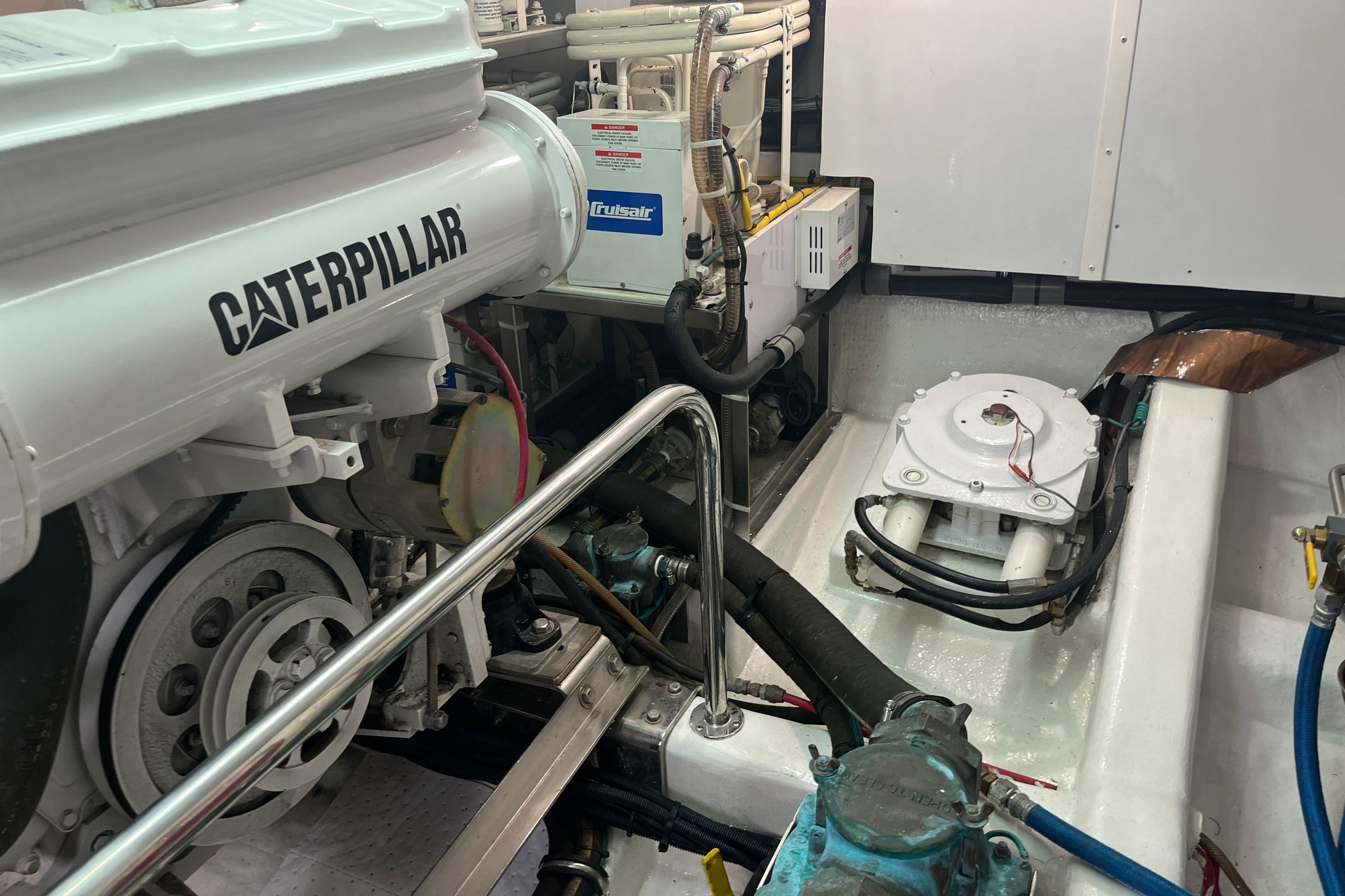 Engine room of 2004 Ocean Alexander 64 Pilothouse with Caterpillar engine and machinery.