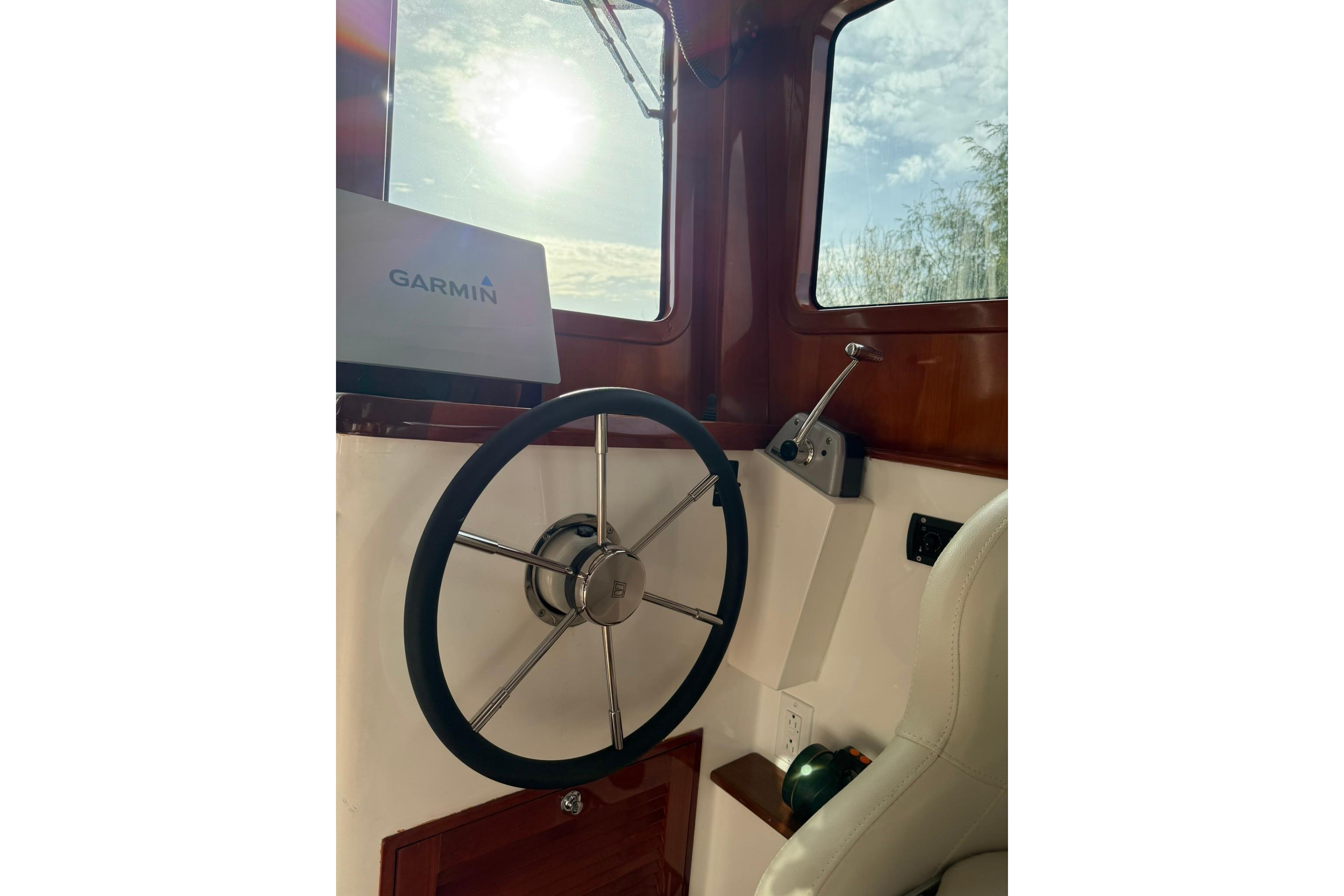 Helm of 2020 SeaPiper 35 boat with Garmin navigation system.