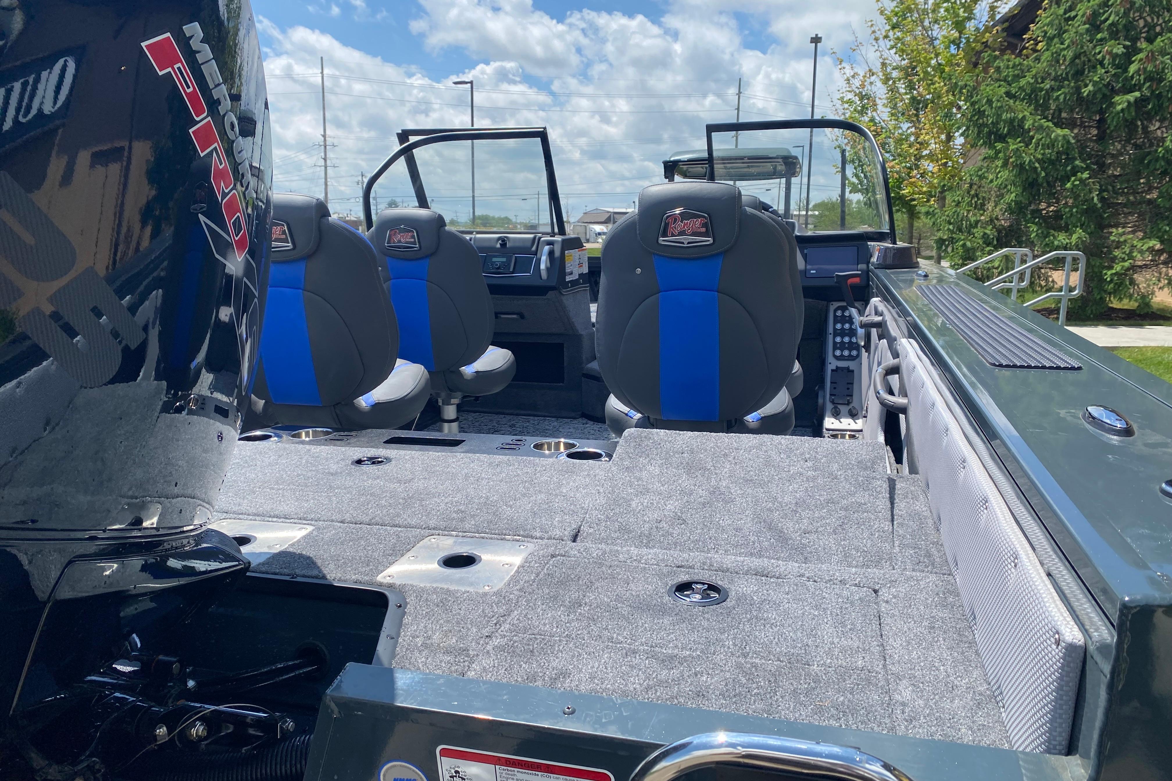 2026 Ranger VX1888 WT boat interior with Mercury Pro motor, featuring blue-accented seats.