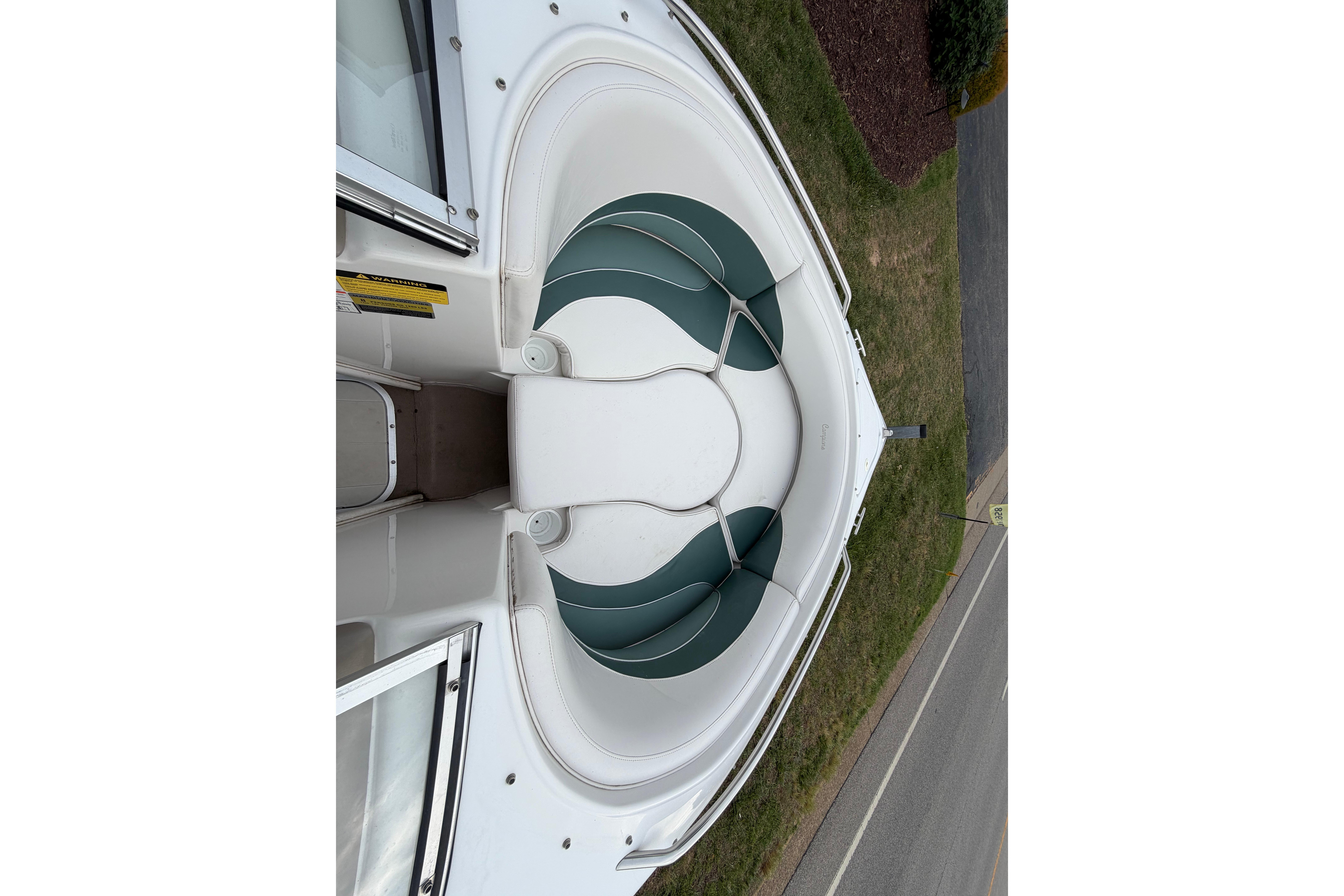 2001 Ebbtide Campione 190 boat interior with green and white seating.