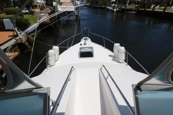 1992 Sea Ray 350 Express Bridge bow view at marina