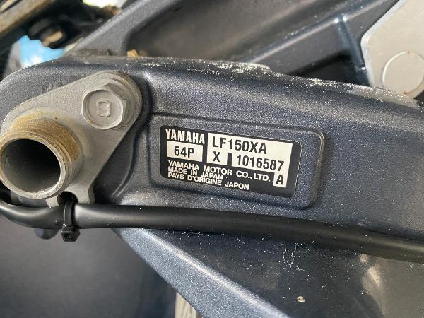 Close-up of a Yamaha engine part with serial number and country of origin.