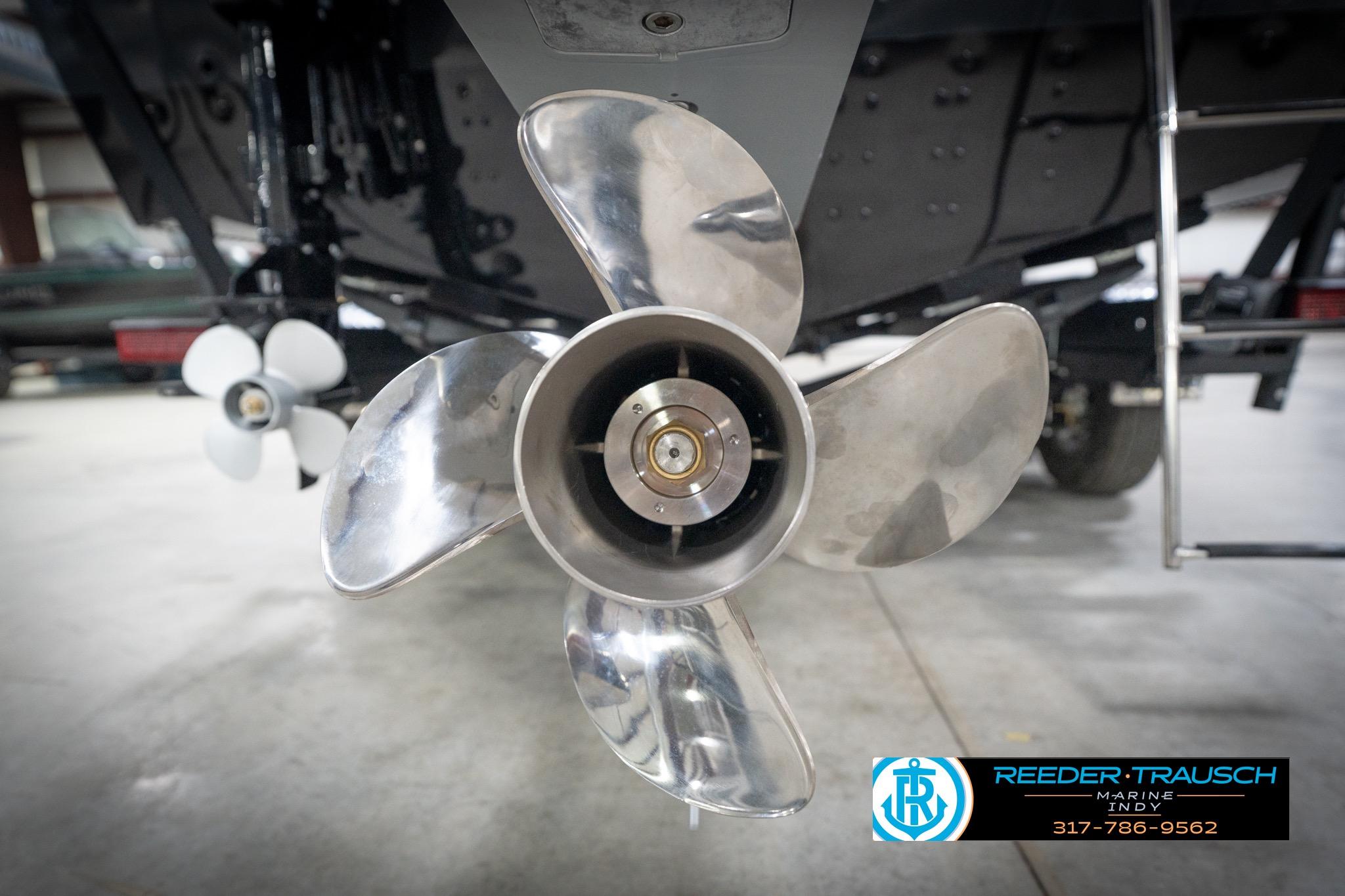Close-up of a 2026 Lund 2275 Baron boat propeller in a showroom.