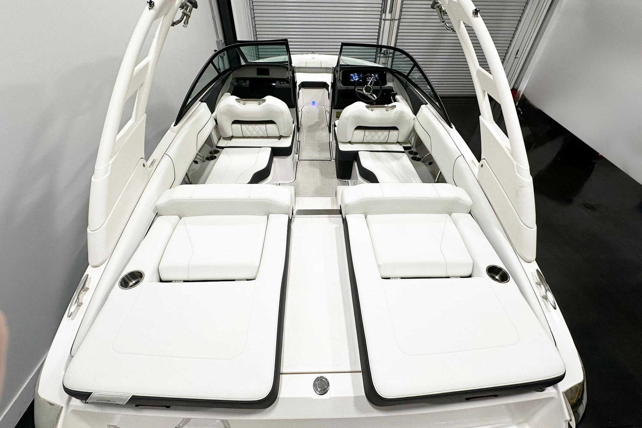 2025 Regal LS2 boat interior with luxurious white seating and modern dashboard design.