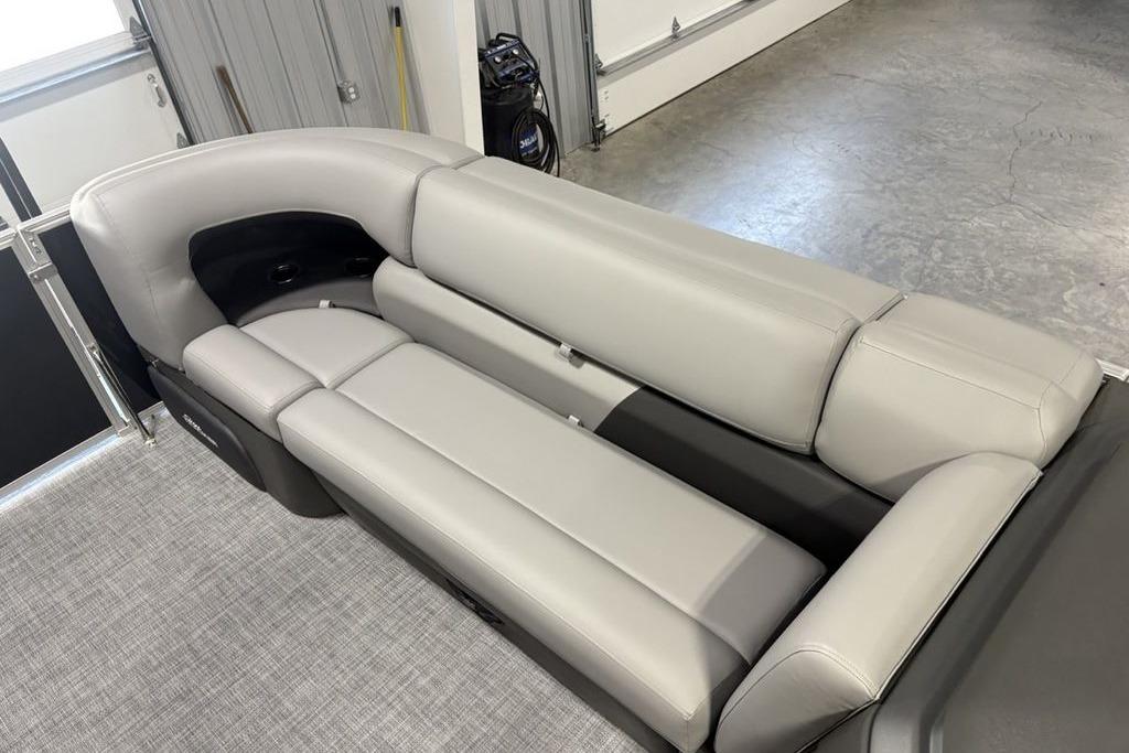 2026 Sun Tracker PARTY BARGE® 20 DLX interior with luxurious gray seating.