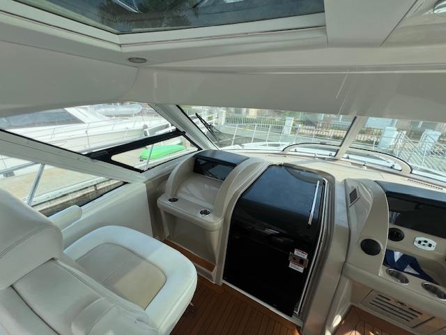 Interior view of 2008 Sea Ray 55 Sundancer yacht cockpit with modern controls and seating.