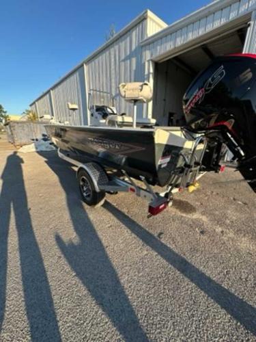 2024 Ranger RB190 boat parked outside a metal building.