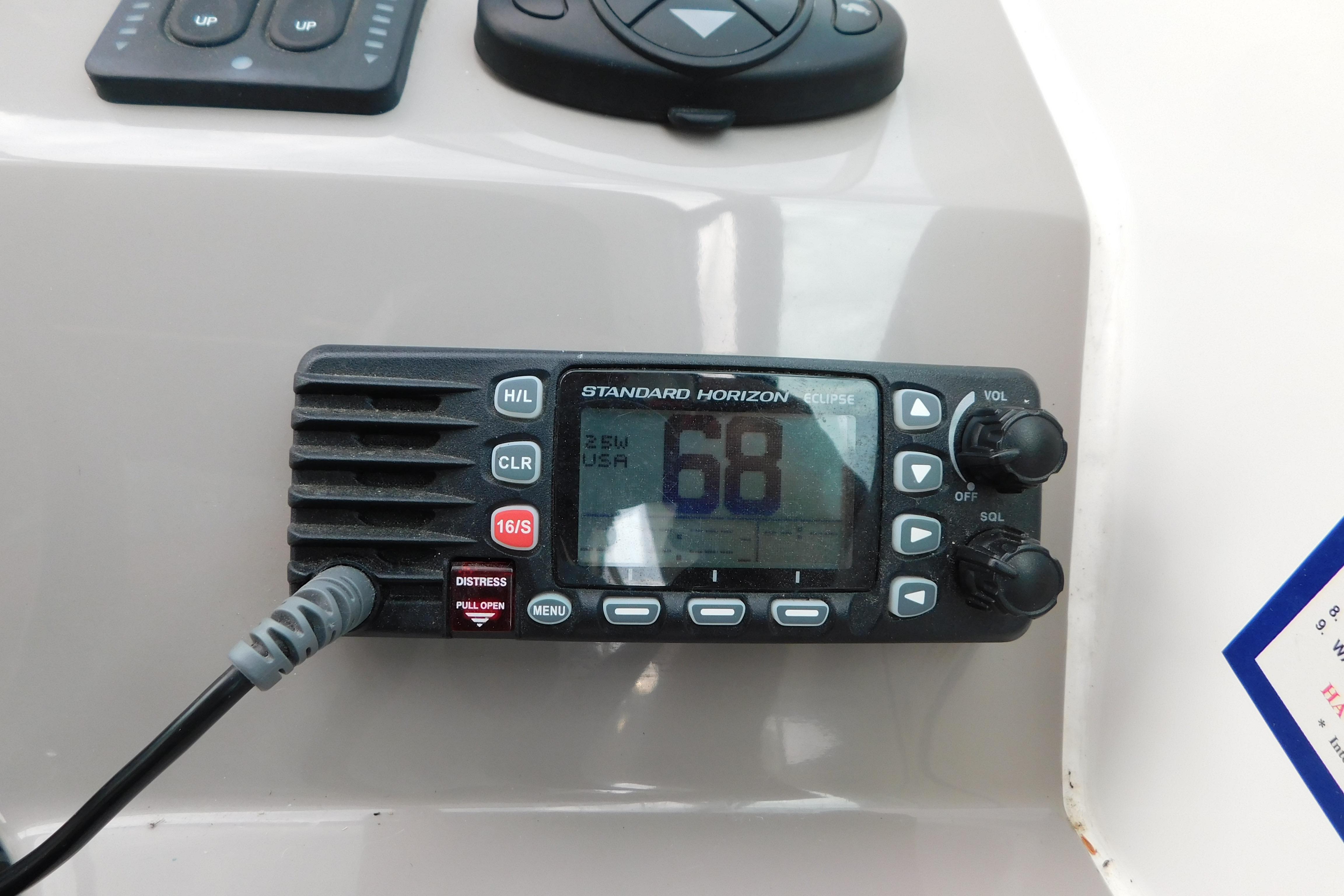 Standard Horizon marine radio on 2017 Rinker EX 320 boat dashboard.