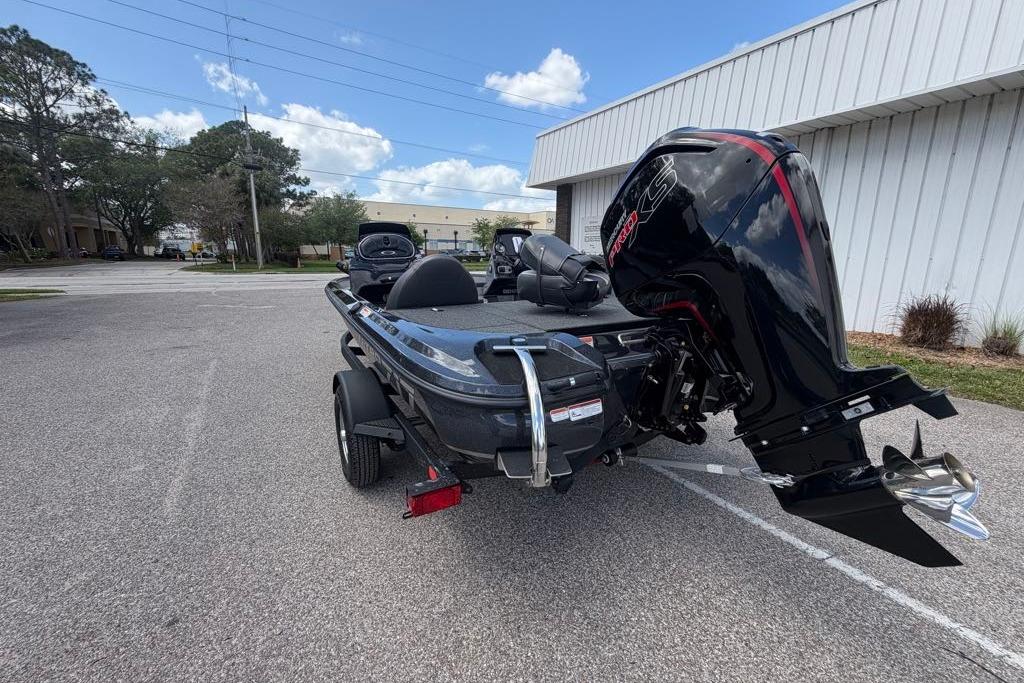 2026 Nitro Z17 boat with powerful outboard motor in a parking lot.