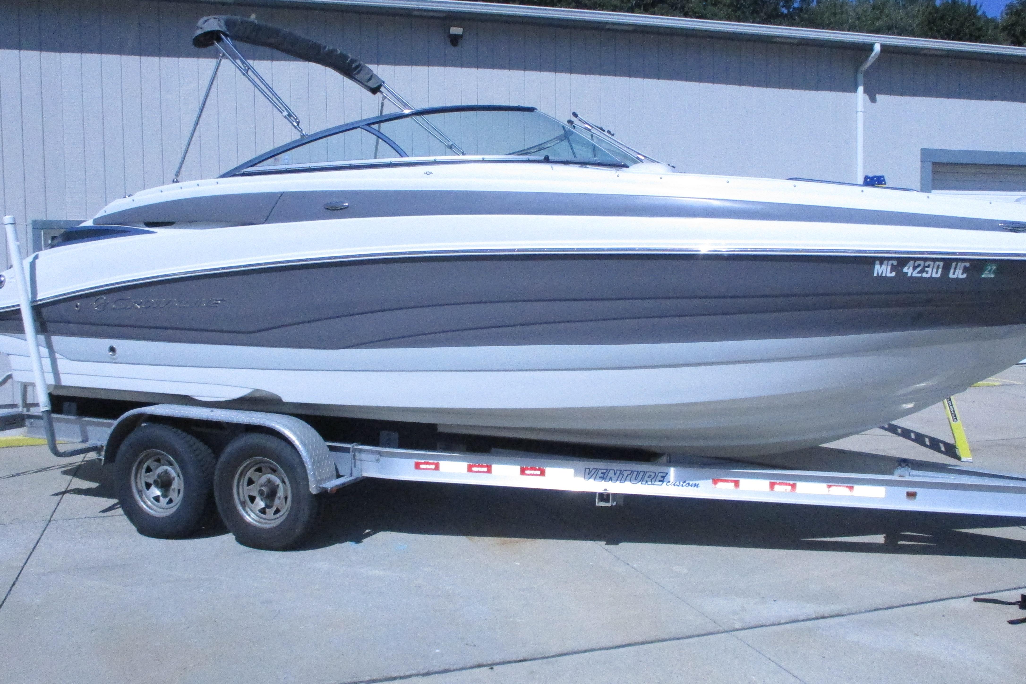 2017 Crownline 255 SS boat on trailer, parked outdoors.