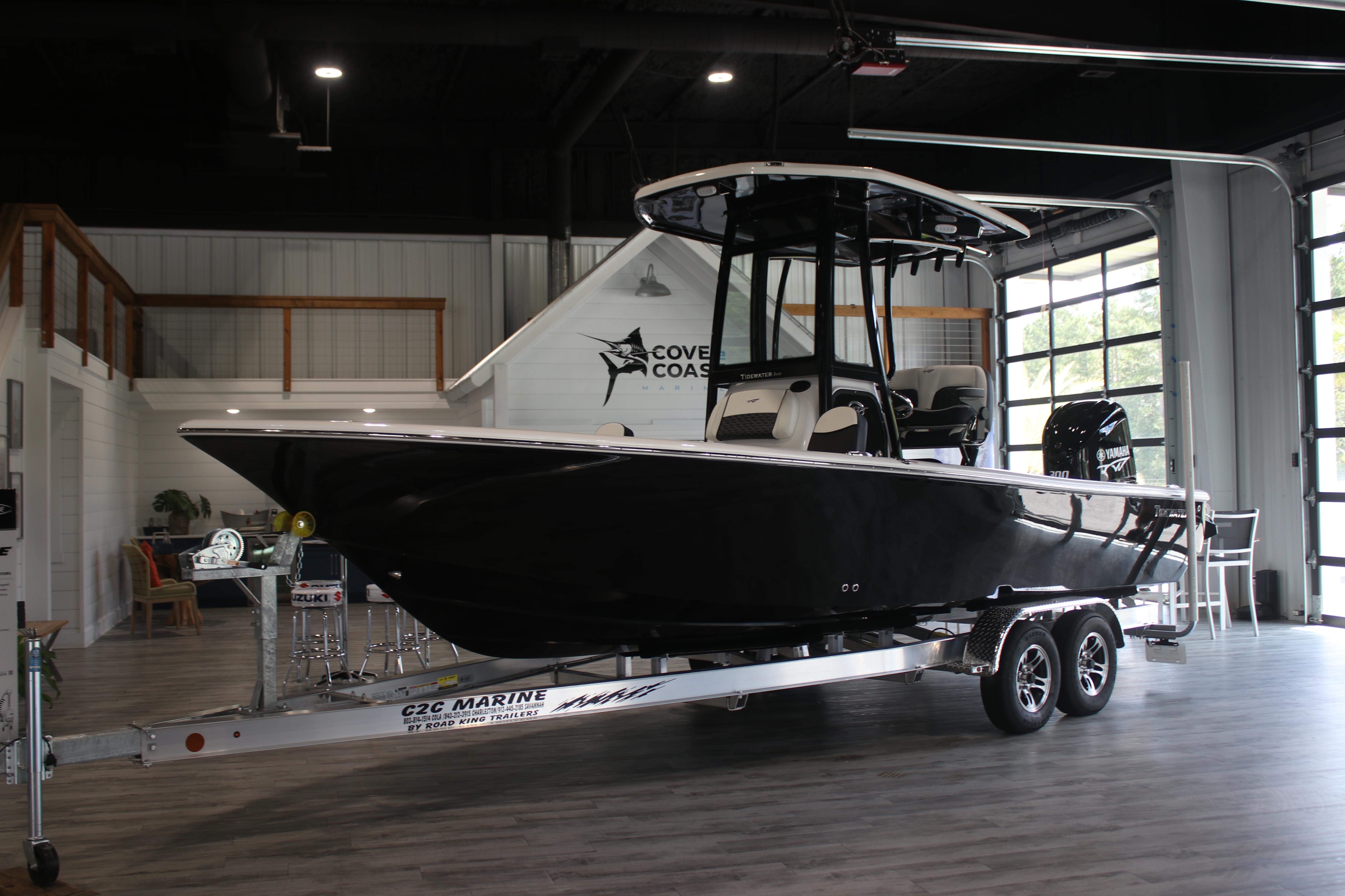 2026 Tidewater 2300 Carolina Bay boat on trailer in showroom.
