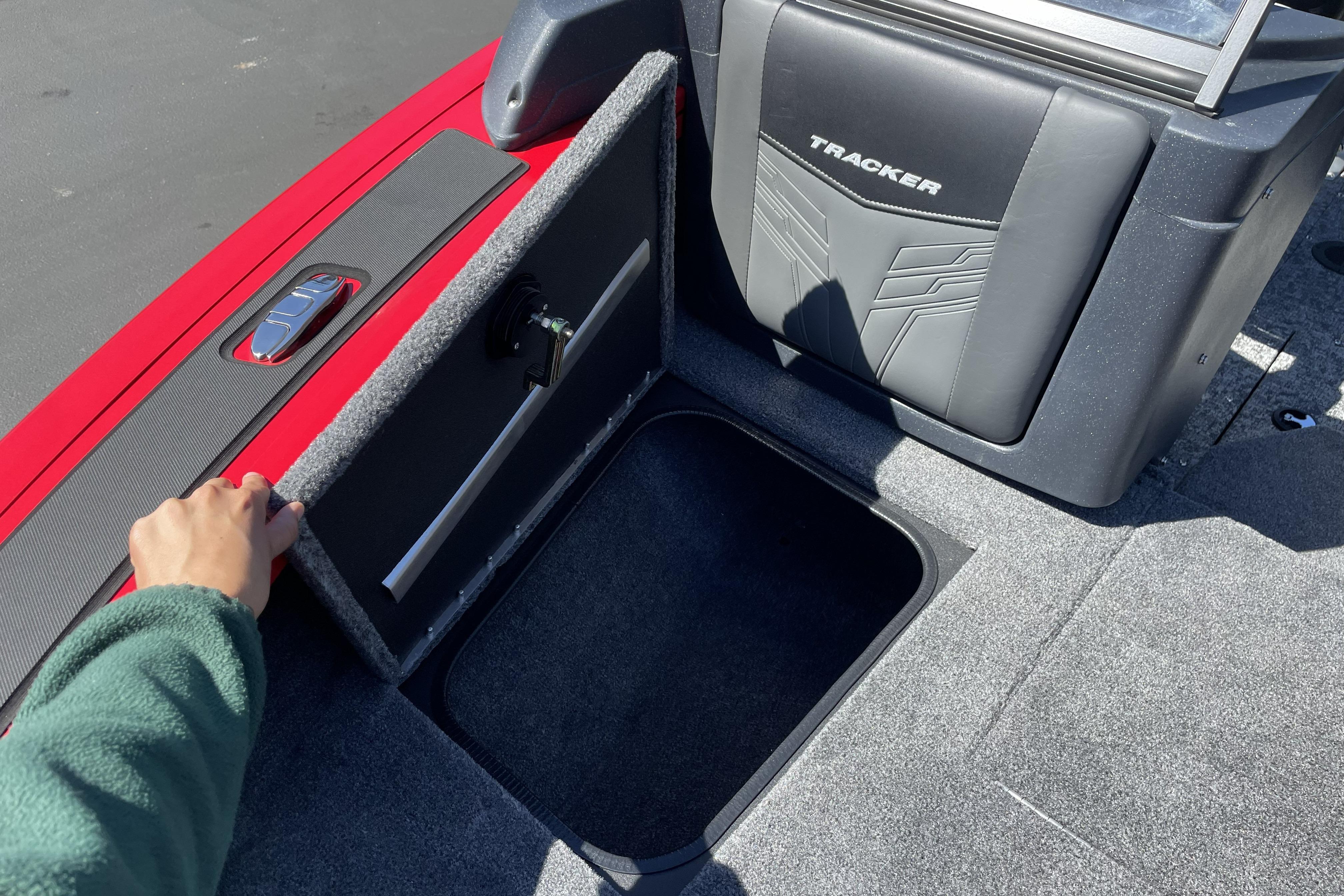2026 Tracker Targa V-18 WT boat storage compartment with open lid, showcasing interior space.