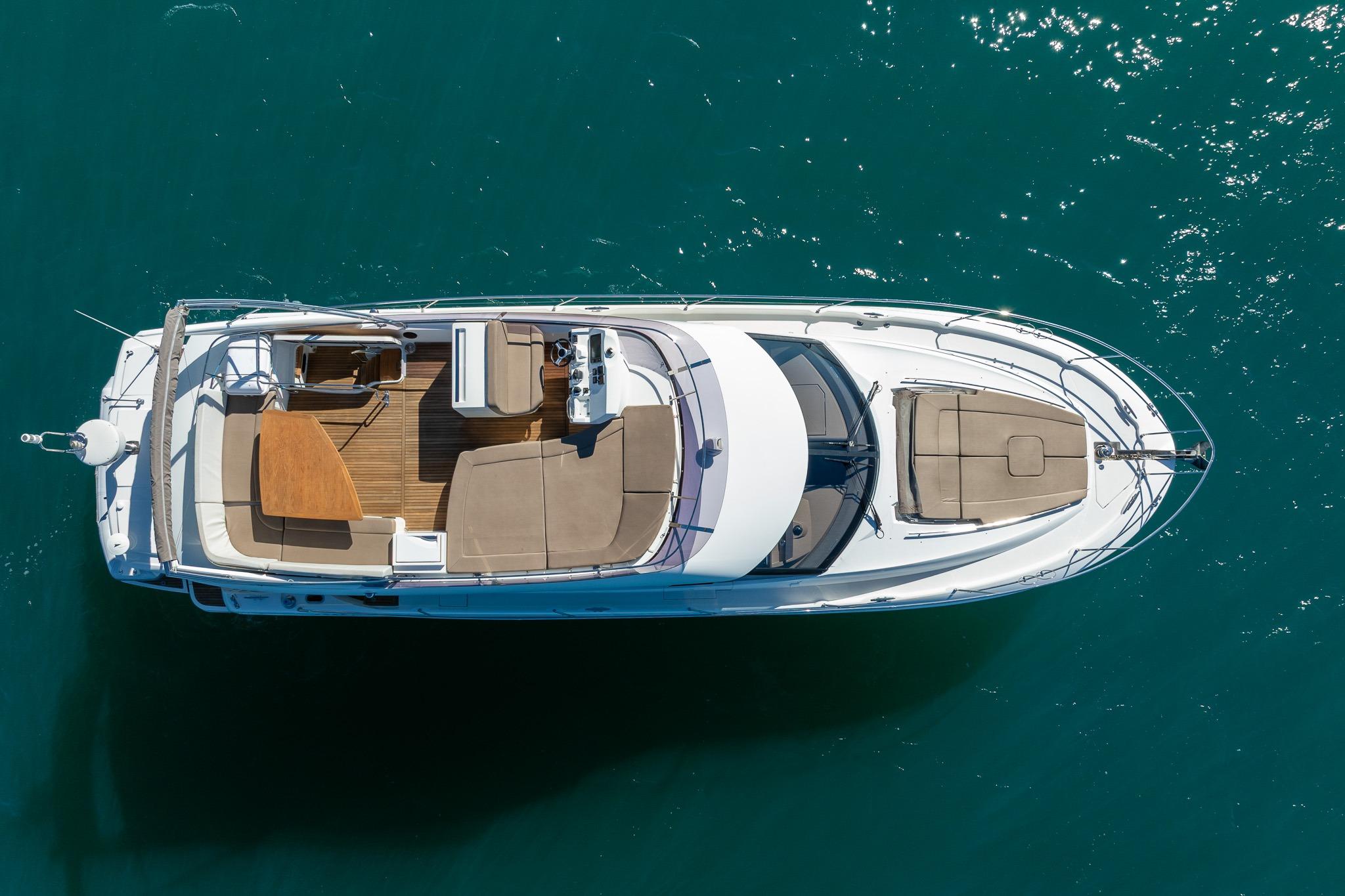 Aerial view of 2017 Prestige 500 yacht on clear blue water.
