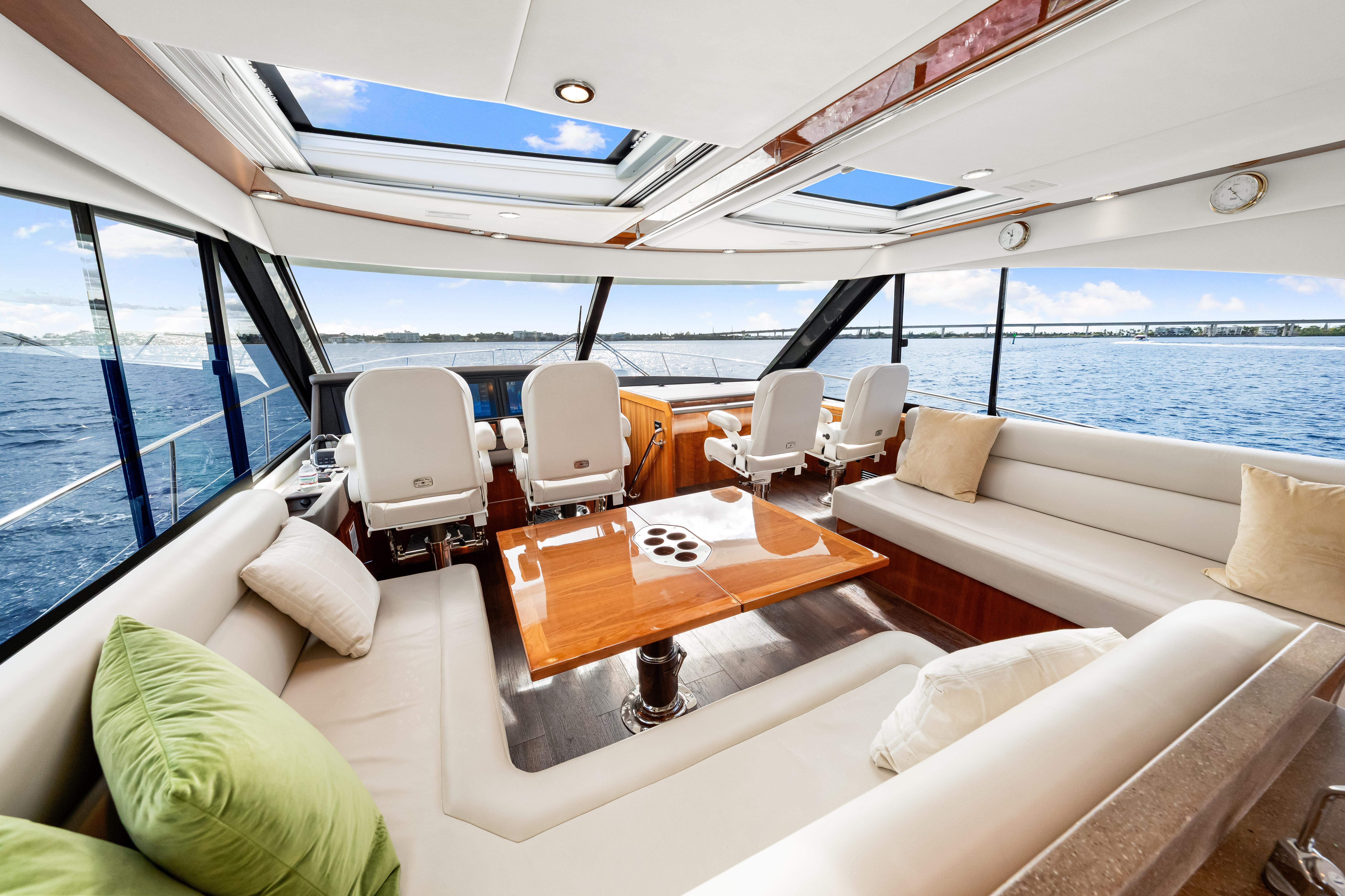 Luxurious interior of 2015 Riviera 565 SUV yacht with panoramic ocean views.