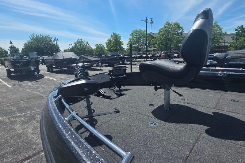 2026 Nitro ZV21 fishing boat with seating, parked outdoors under a clear blue sky.