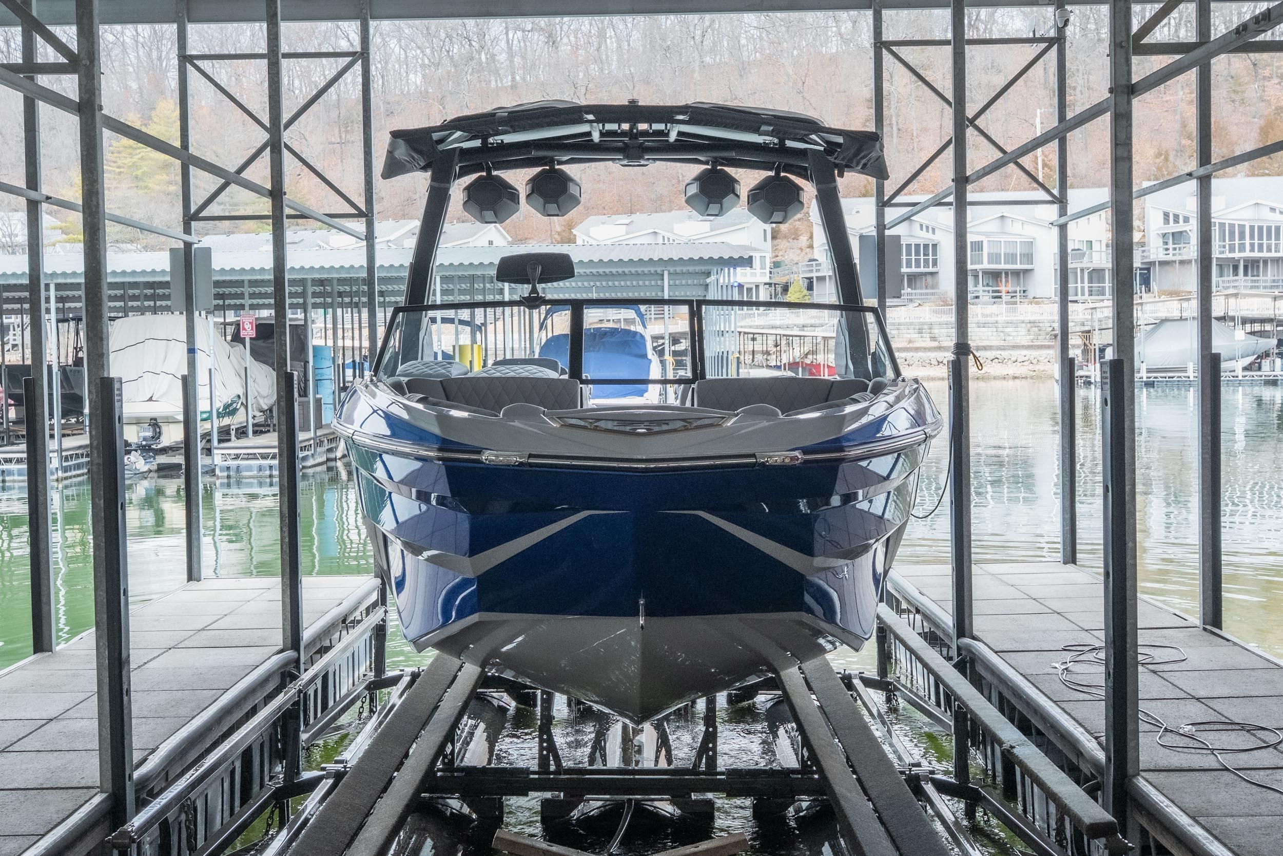 2026 Tigé Z3 boat docked in a marina, showcasing sleek design and modern features.