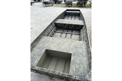 2026 Tracker Grizzly 15 Jon boat with open interior design on gravel surface.