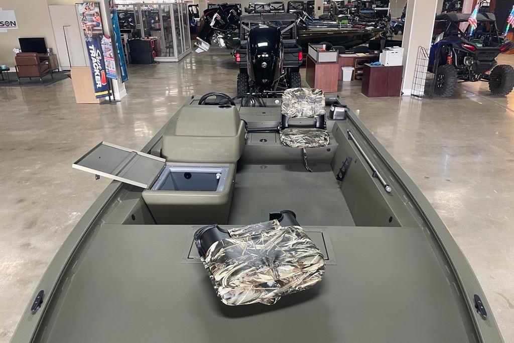 2026 Tracker Grizzly 1754 SC boat with camo seats and open storage compartment.