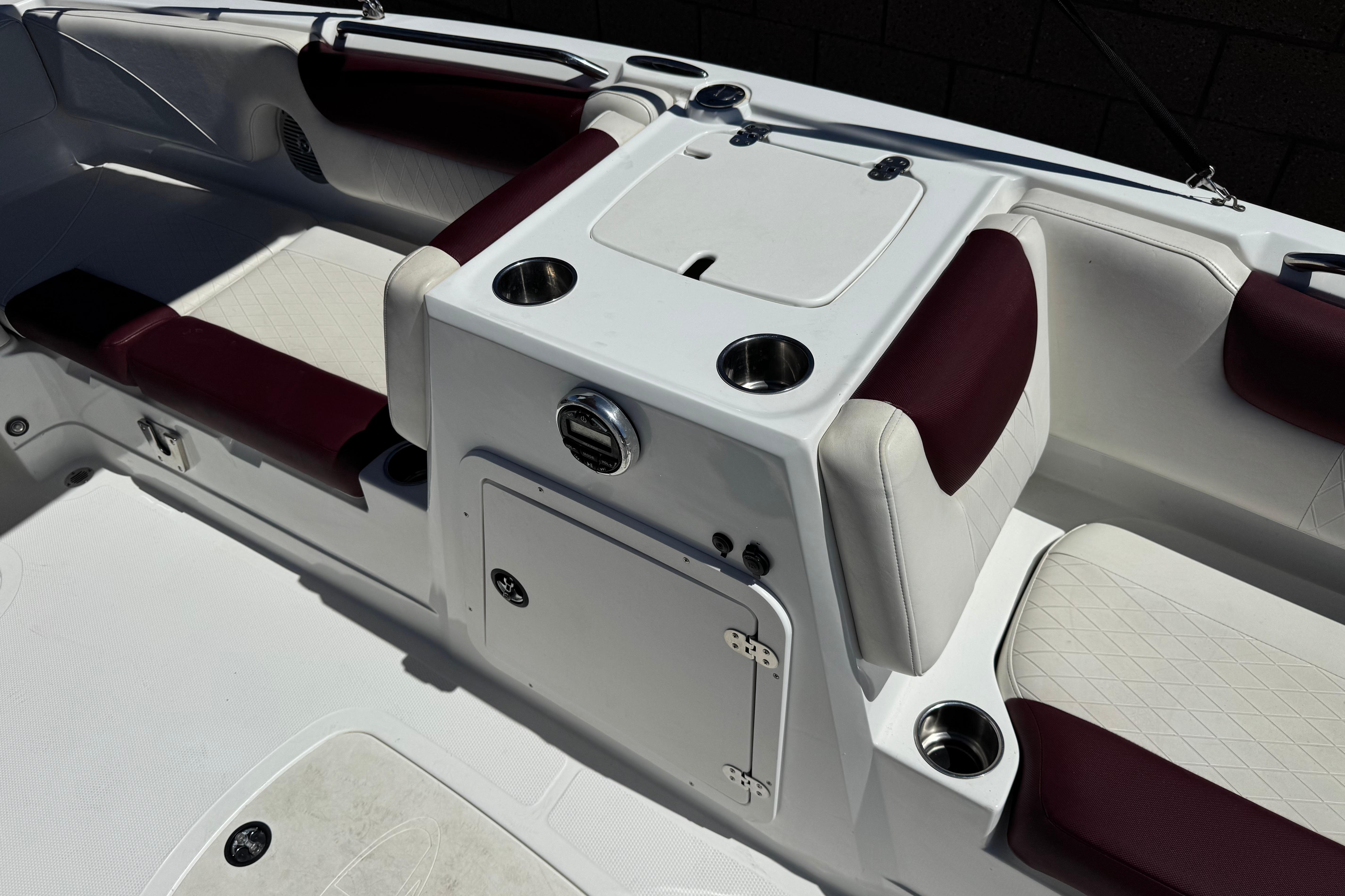 Interior of a 2017 Tahoe 2150 boat with white and maroon seating.