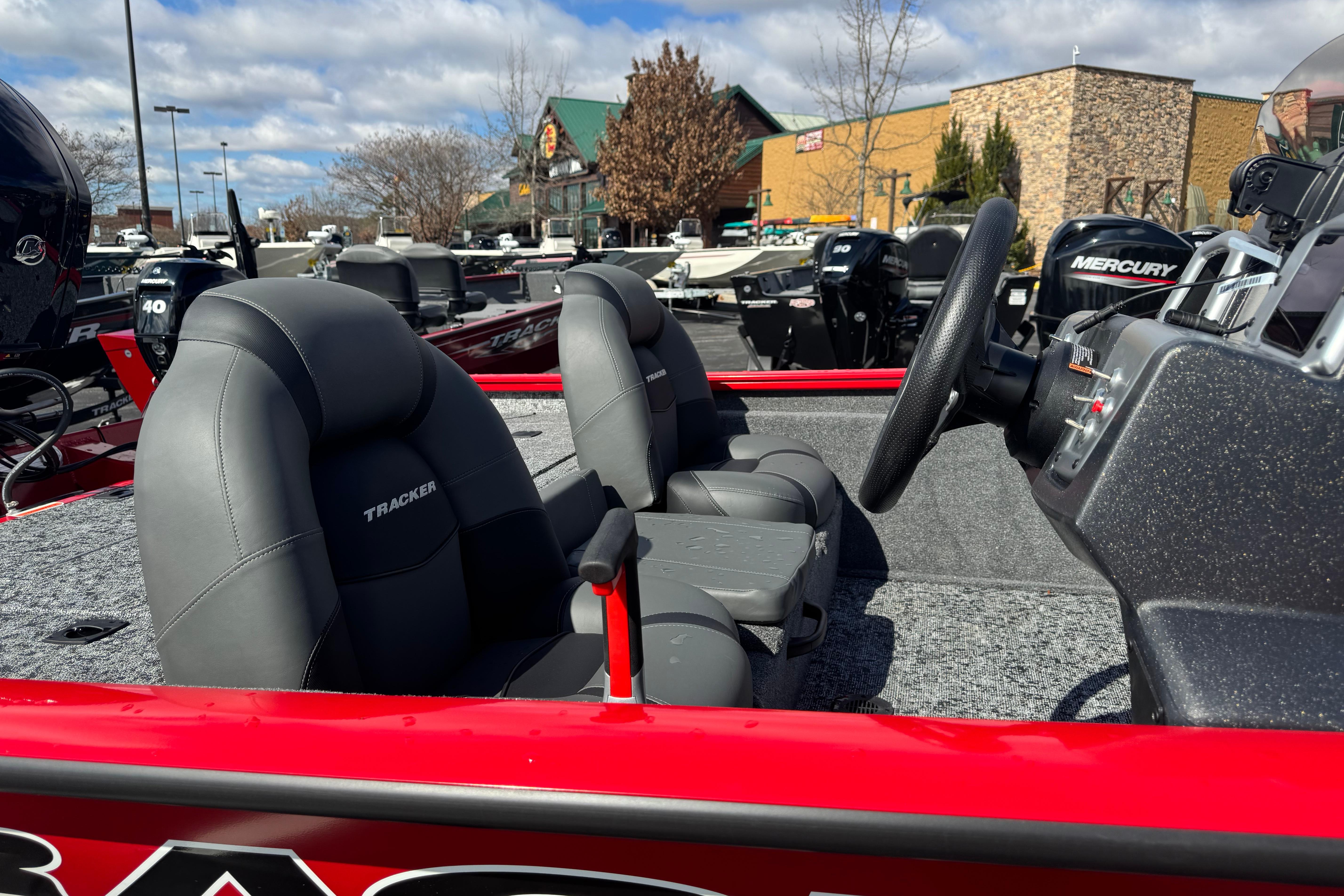 2026 Tracker Pro Team 175 boat interior with steering wheel and seats.