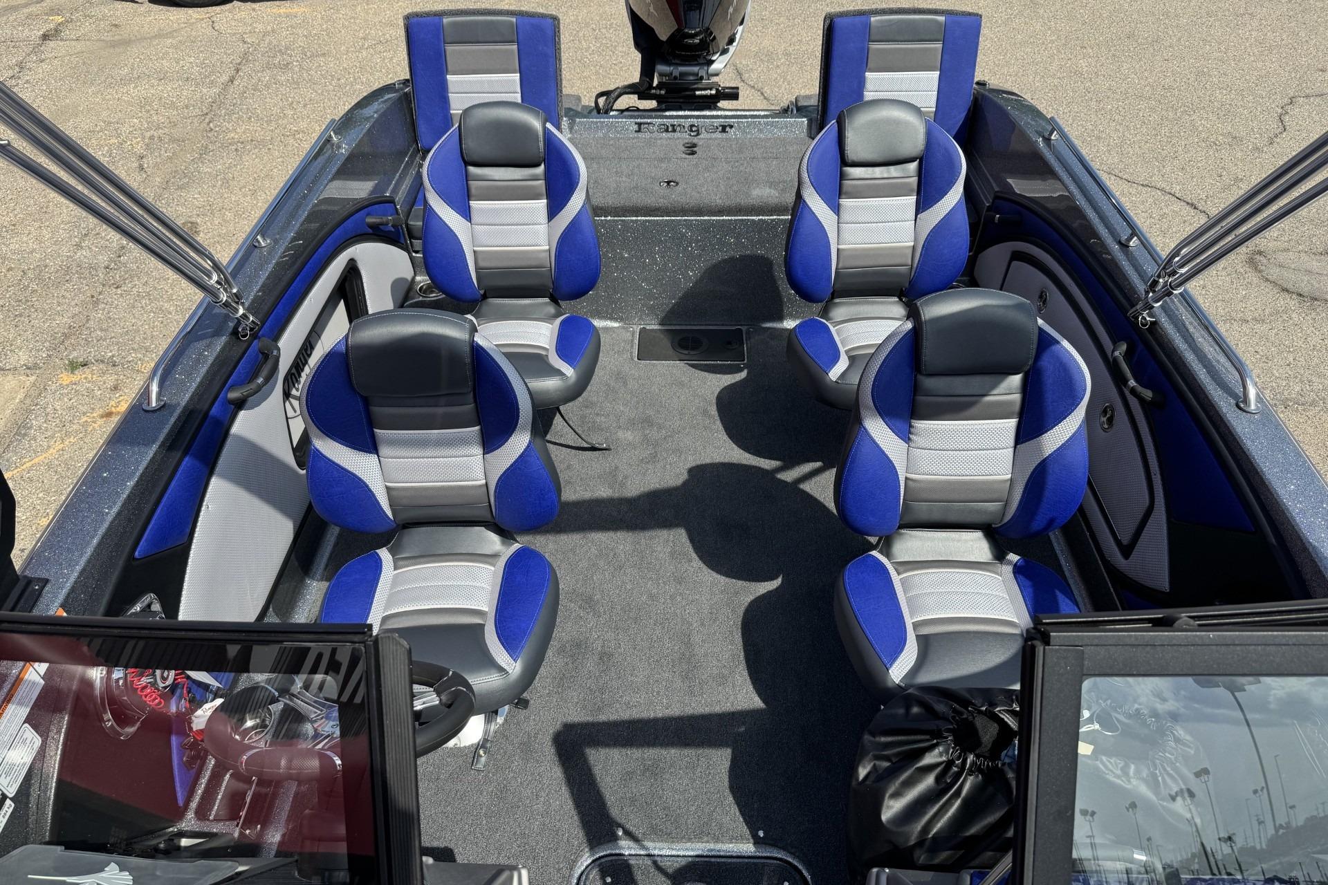 2026 Ranger 2050MS boat interior with blue and gray seating, showcasing spacious design.