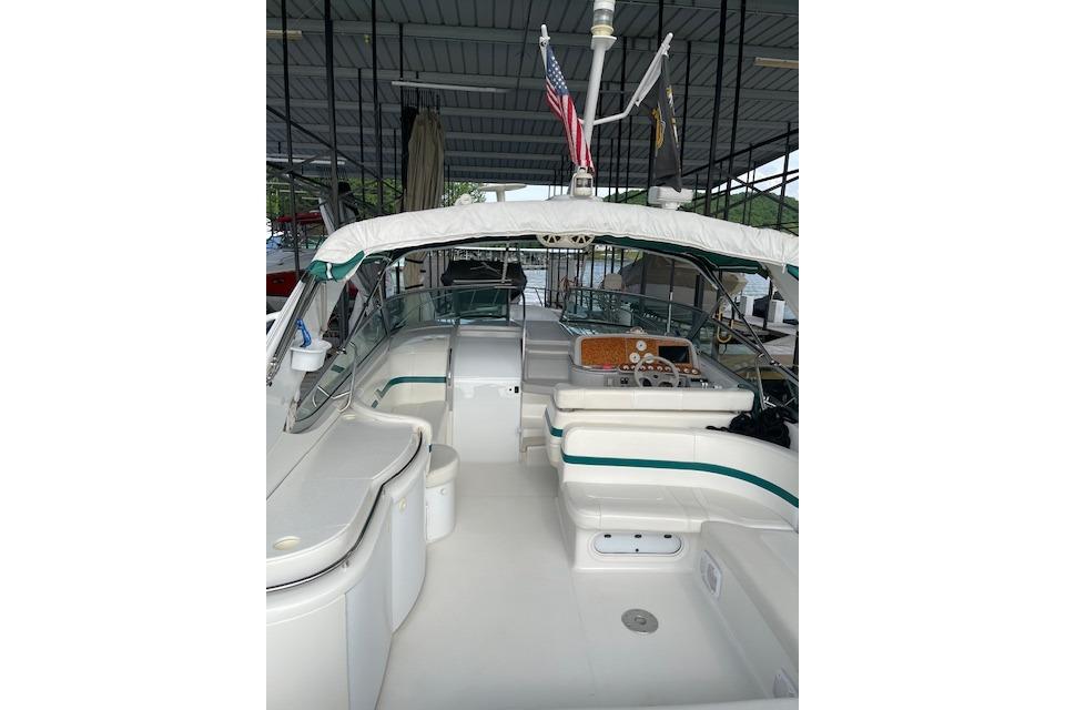 1999 Formula 400 Super Sport boat interior with seating and control panel in covered dock.