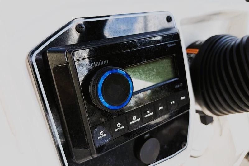 Close-up of a Clarion audio system on a 2026 Hurricane SunDeck Sport 2050 OB boat.