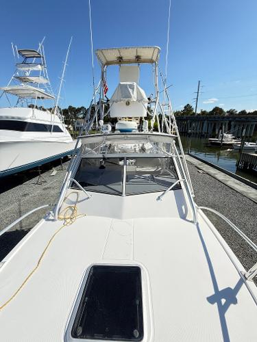 2001 Albemarle 280 Express Sport Fisherman boat docked, featuring diesel power and sleek design.