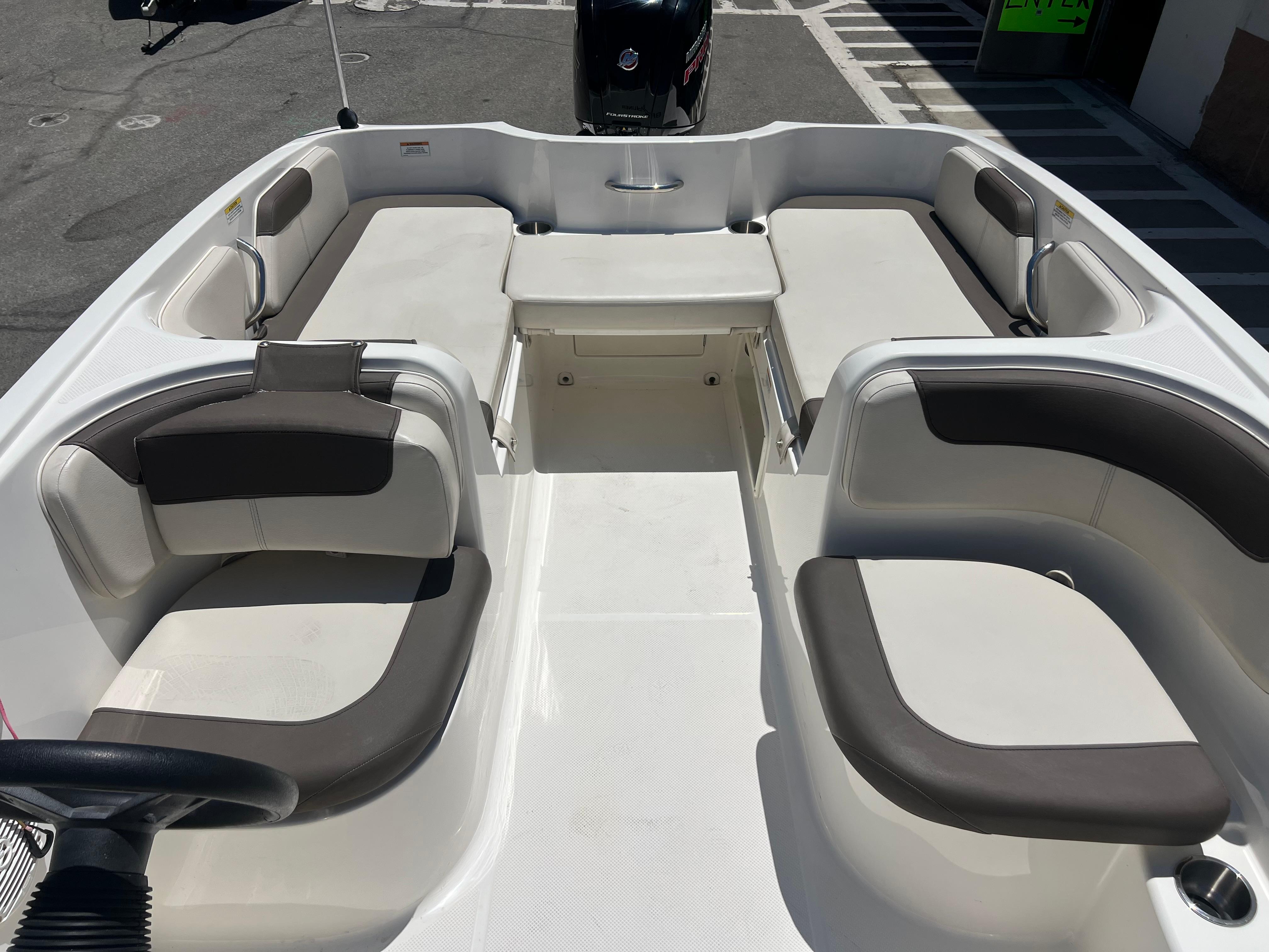 2023 Bayliner Element E18 boat interior with spacious seating and modern design.