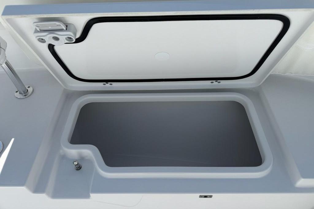 Open storage compartment on 2026 Sportsman Open 252 Center Console boat.