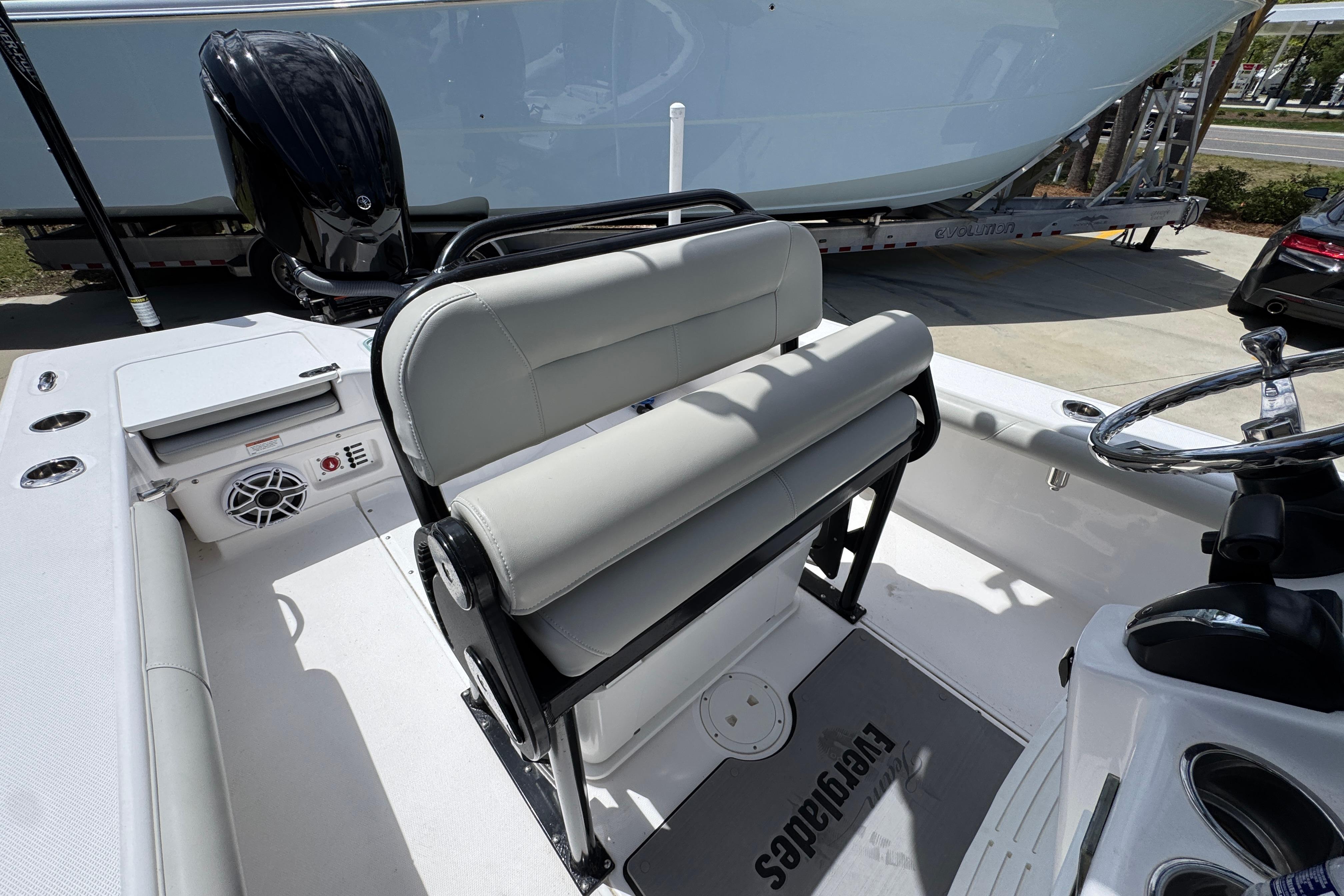 2022 Everglades 243 Center Console boat interior with seating and steering wheel.