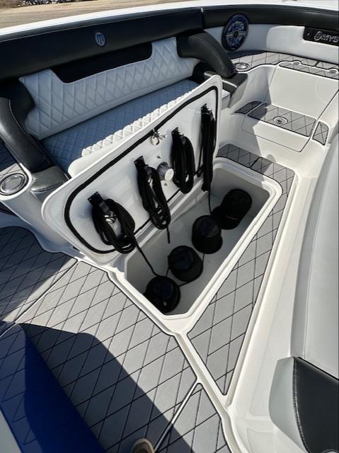 2019 Mystic Powerboats M4200 interior storage compartment with ropes and accessories.