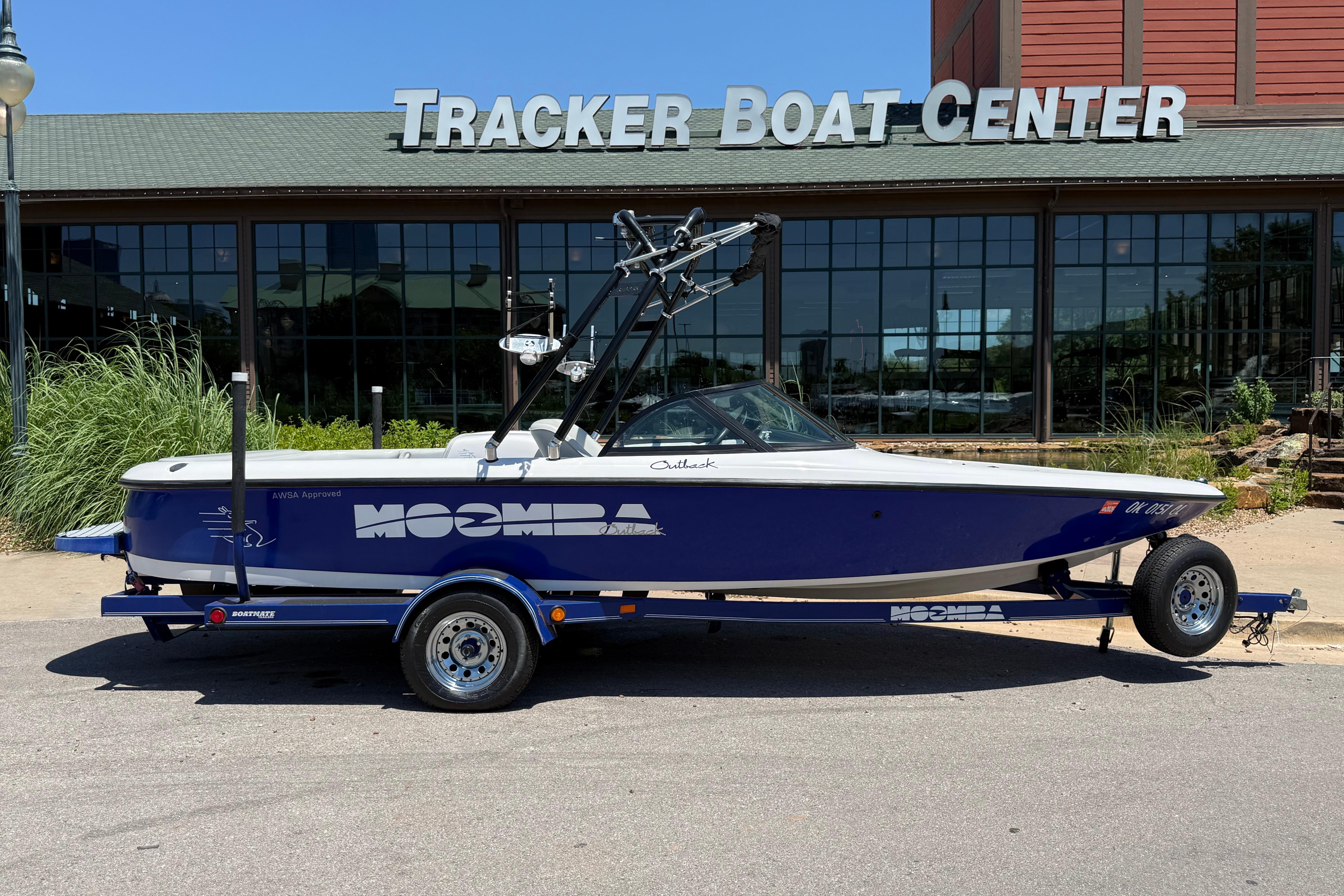 2001 Moomba Outback boat on trailer outside Tracker Boat Center.
