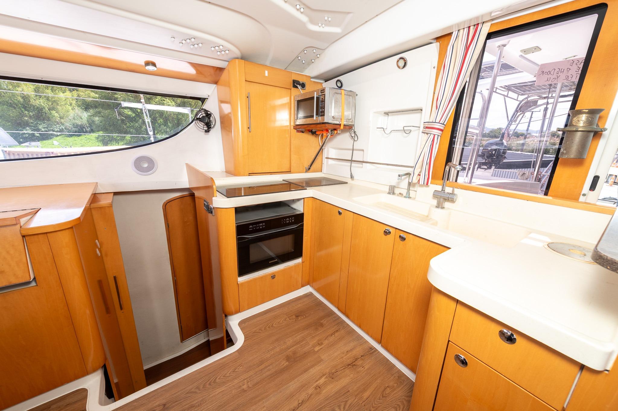Spacious kitchen interior of 2008 Fountaine Pajot Orana 44 catamaran with modern amenities.