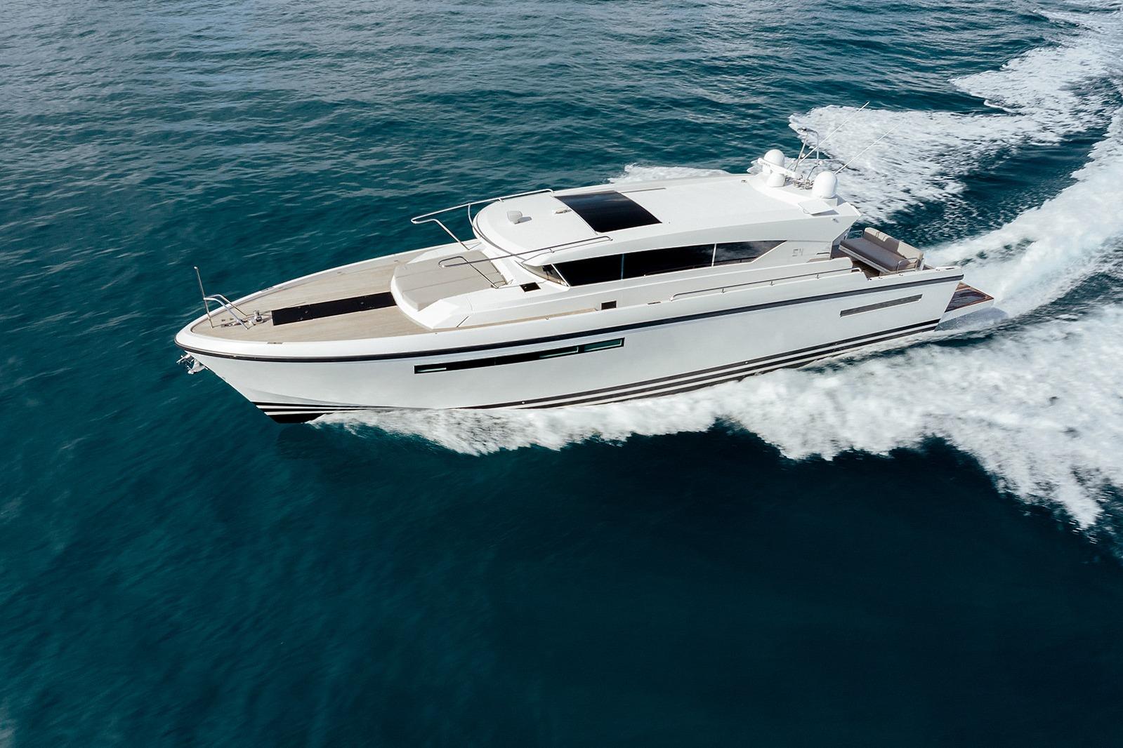 2023 Delta Powerboats 54 IPS cruising on open water, showcasing sleek design and performance.