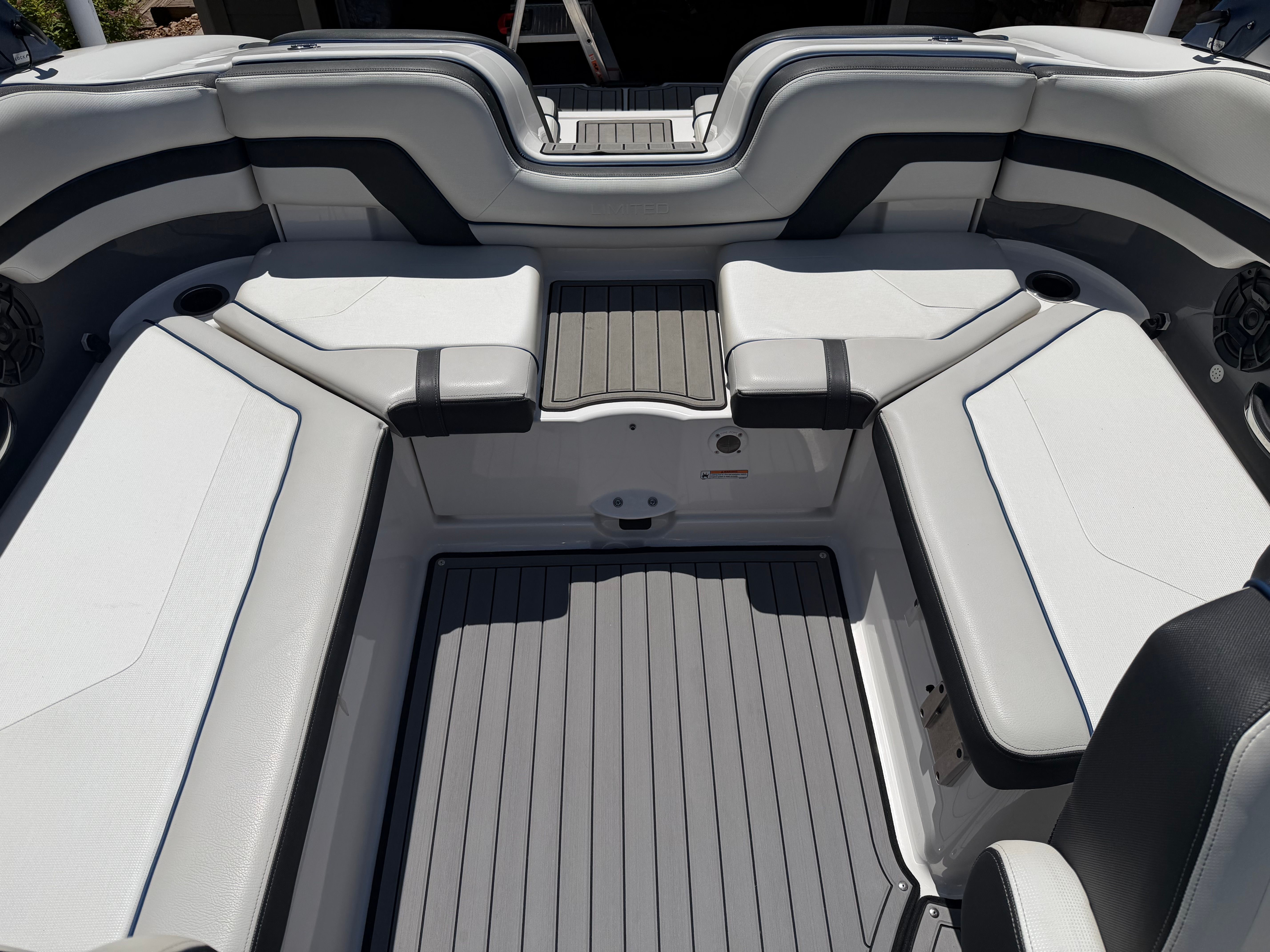The image shows the interior of a 2018 Yamaha 242 Limited S boat with gray and white seating.