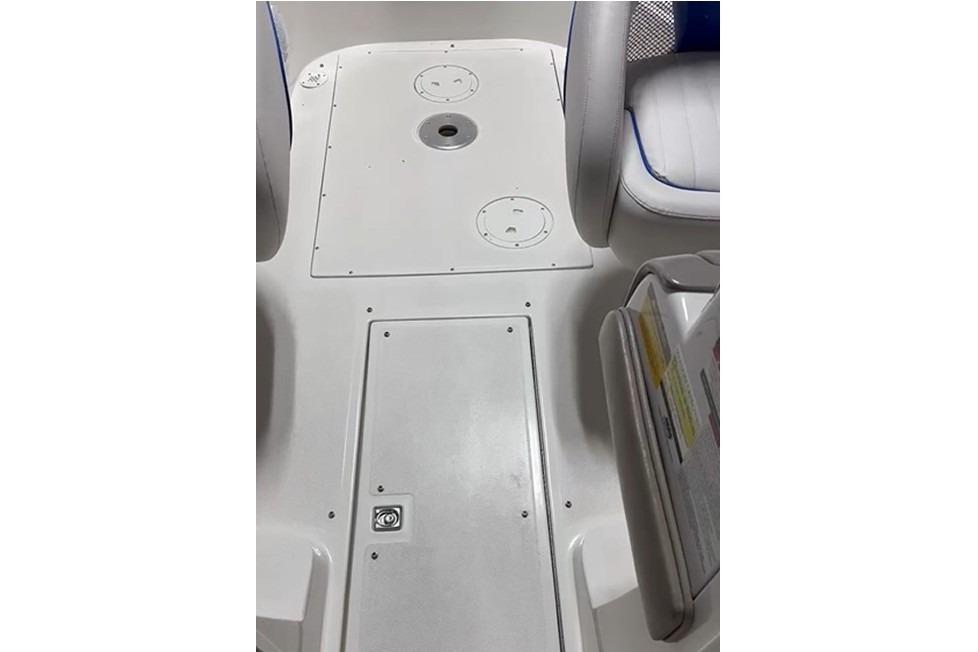 1999 Tide Craft Trophy Angler boat interior with white seating and storage compartments.